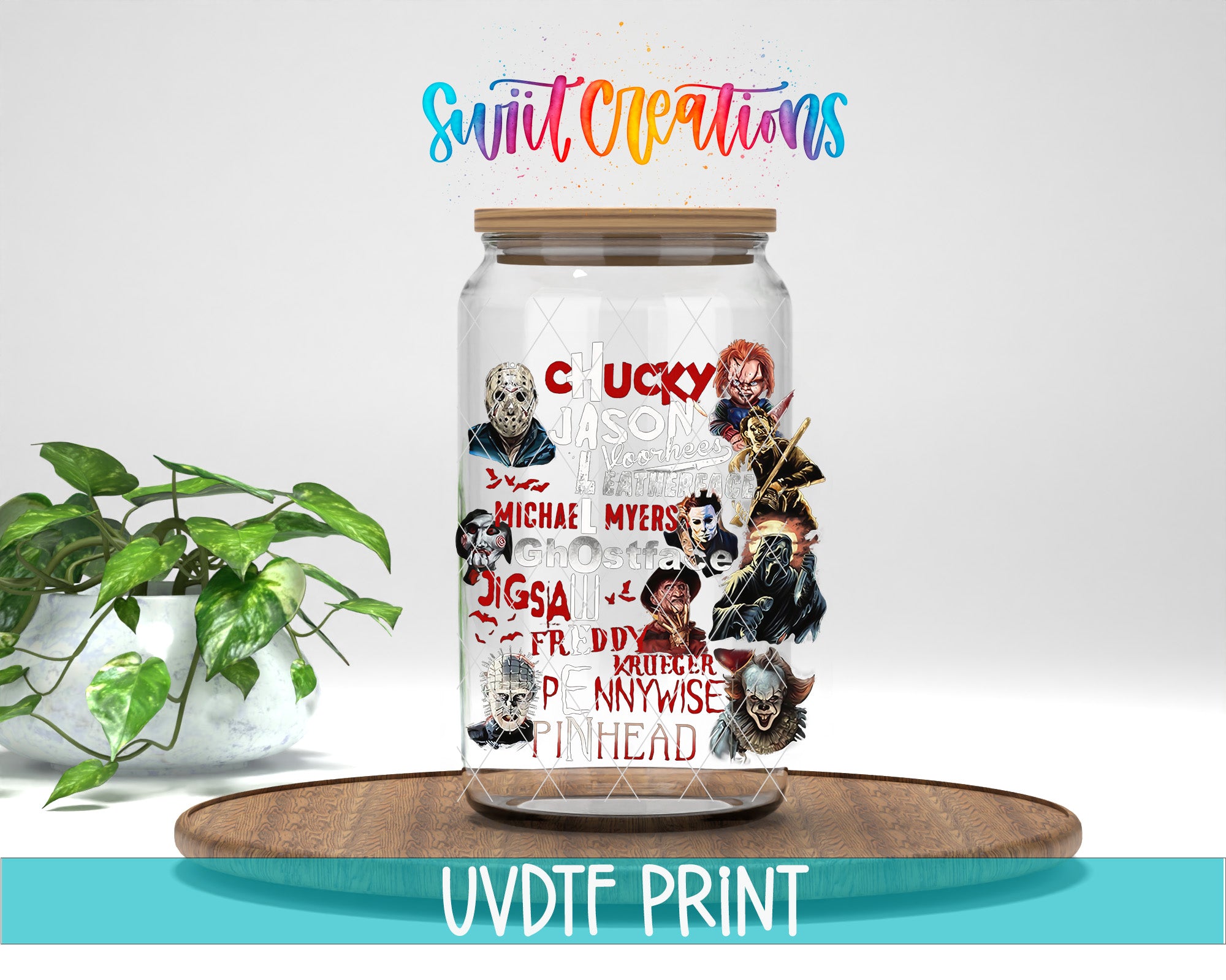 a jar with some pictures on it next to a potted plant