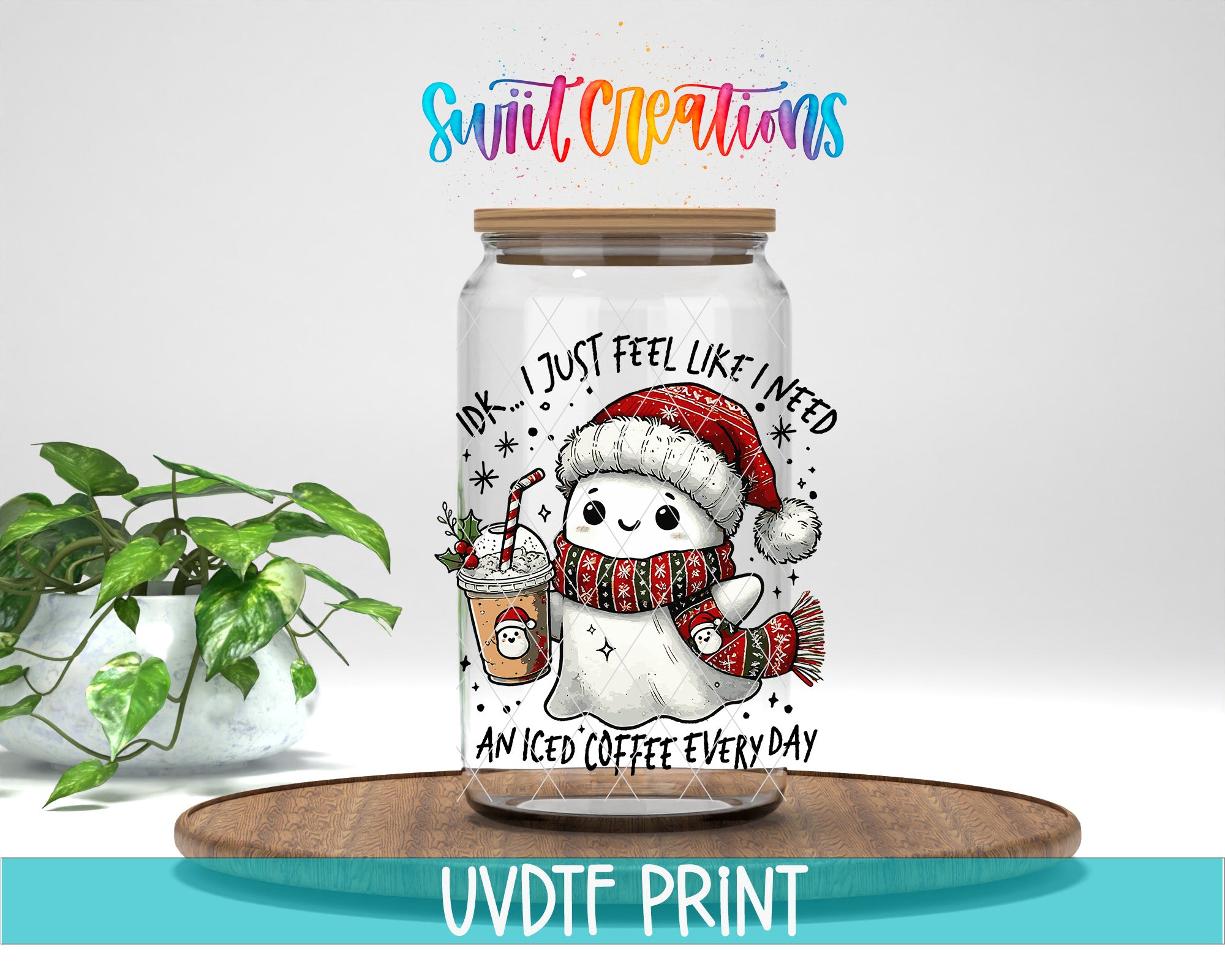 A glass jar with a cartoon snowman and a hot beverage inside, along with text that says "I just feel like I need an iced coffee every day".