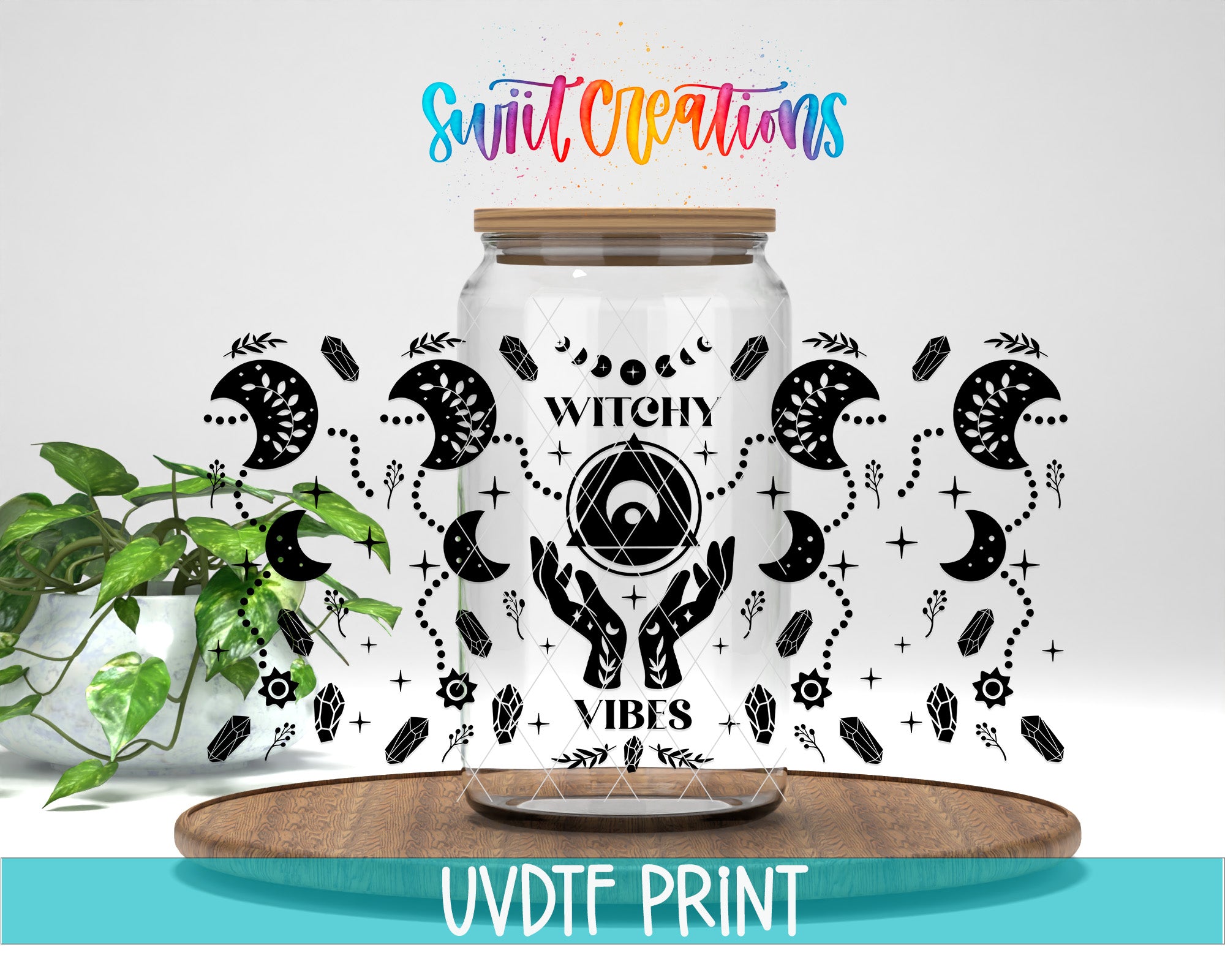 a glass jar with a label that says "Witch Vibes" surrounded by various mystical and supernatural symbols, such as crescent moons, crystals, and a pentagram. The jar is placed on a wooden surface, and there is a potted plant in the background. The text "Swit Creations" is written above the jar, and "UVDF PRINT" is written at the bottom of the image.