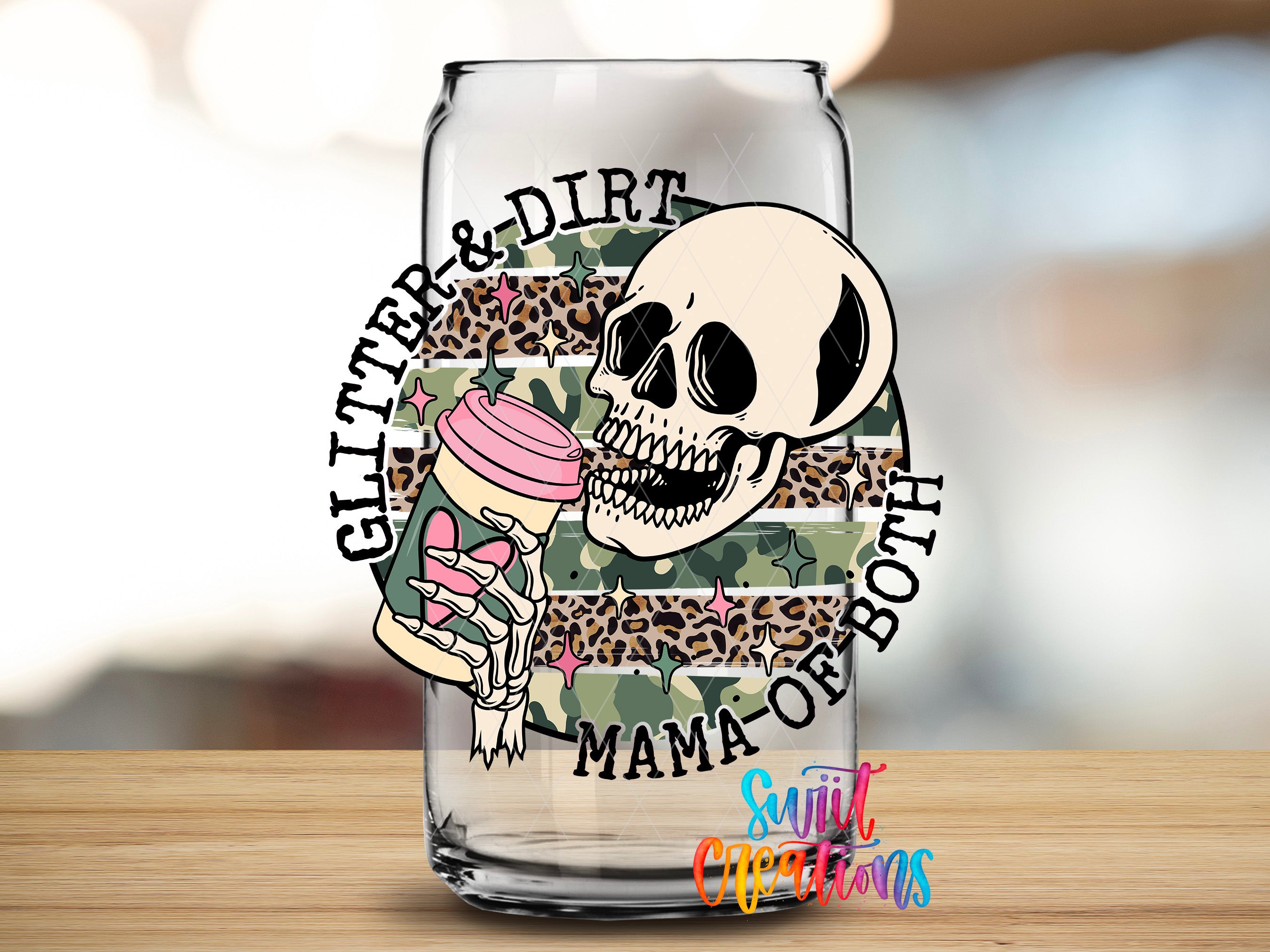 A glass with a skull and leopard print design, along with the text "GITTER & DIR" and "MAMA OF BOTH" printed on it.