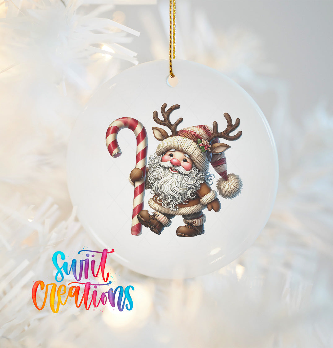 A white ornament featuring a cartoon Santa Claus holding a candy cane and antlers, with a text overlay that reads "Swit Creations".