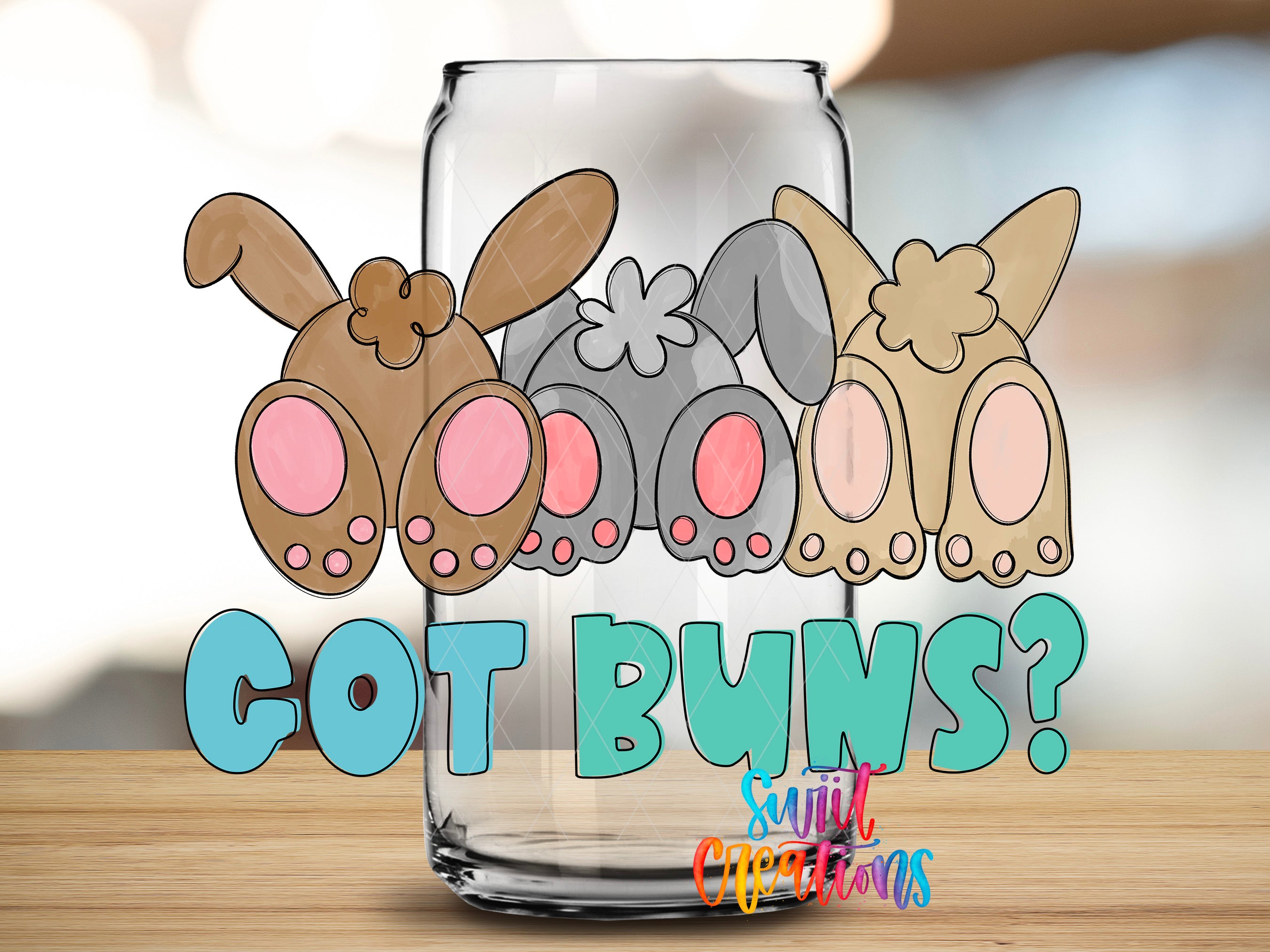 A glass jar with cartoon rabbit ears and the text "GOT BUNS?" written on it.