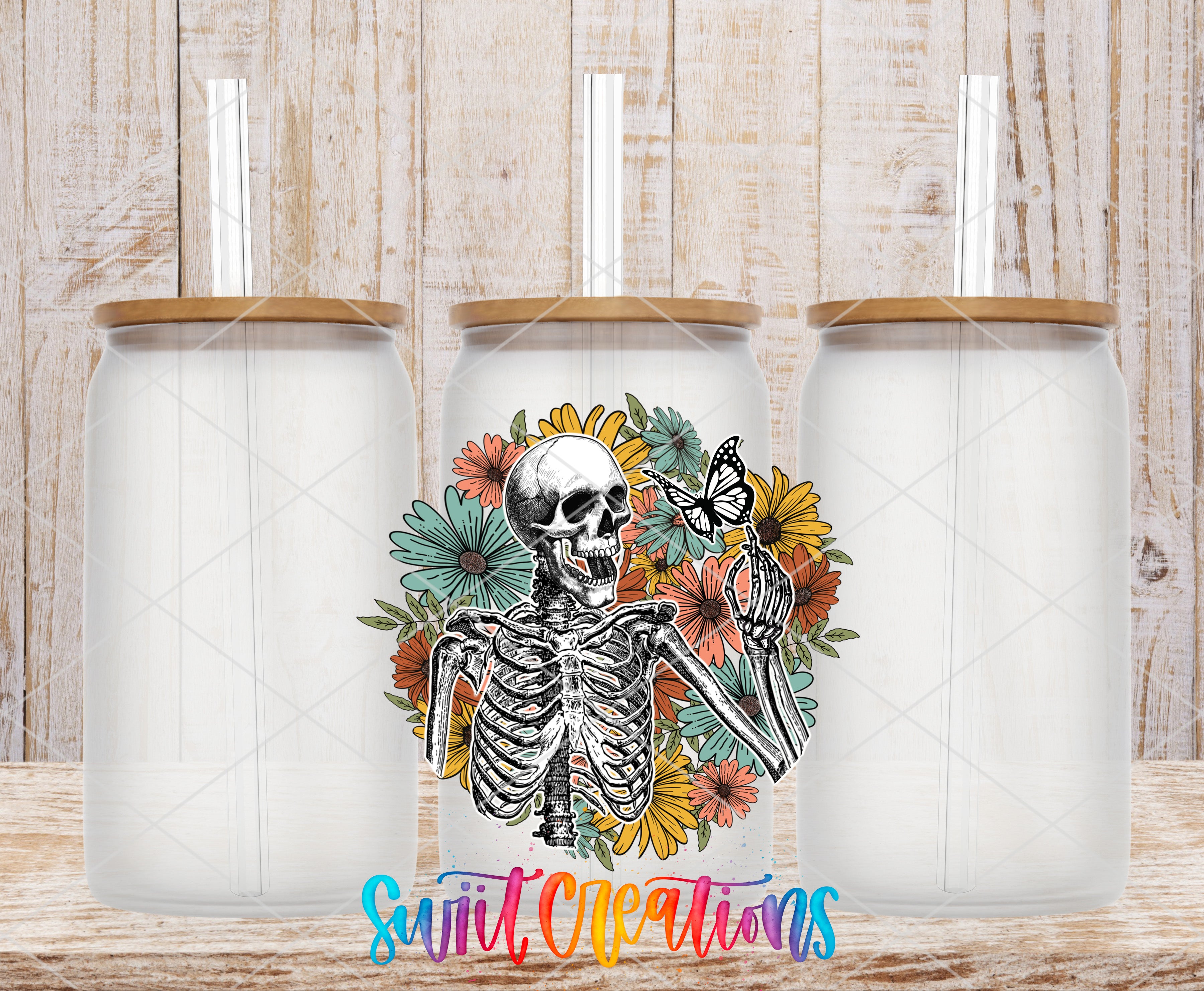Swiit Creations UV DTF Skeleton Floral transfer shown on a clear glass can set