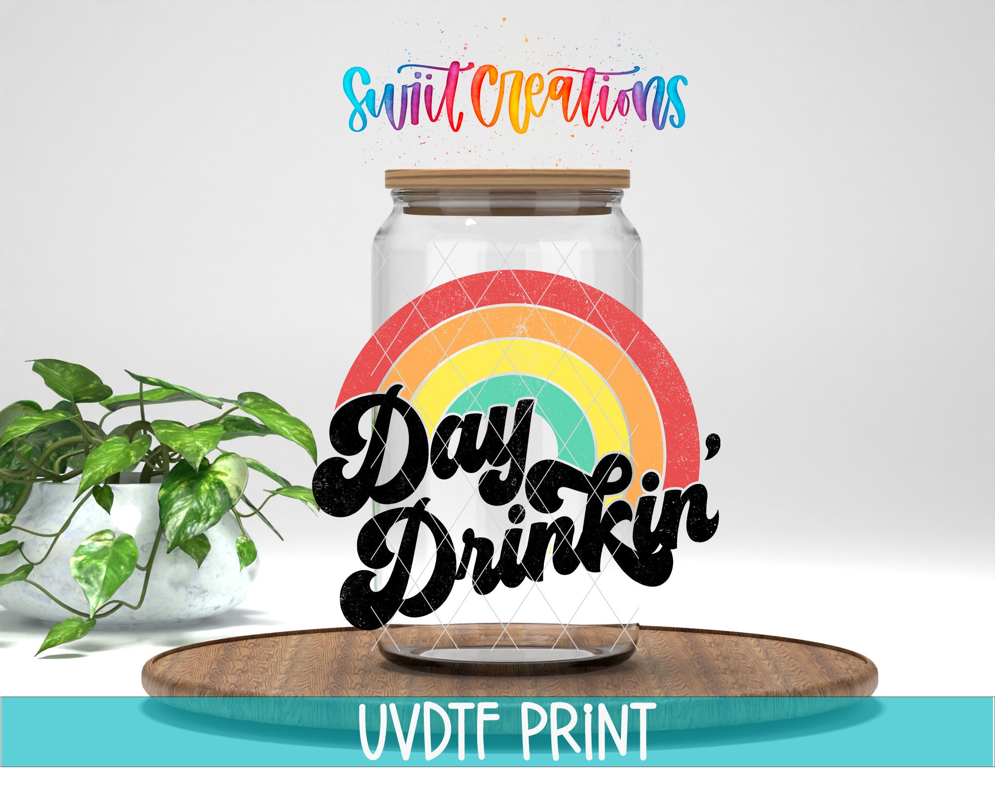 a glass jar with a rainbow design and the text "Day Drinkin'" on it, placed on a wooden surface.