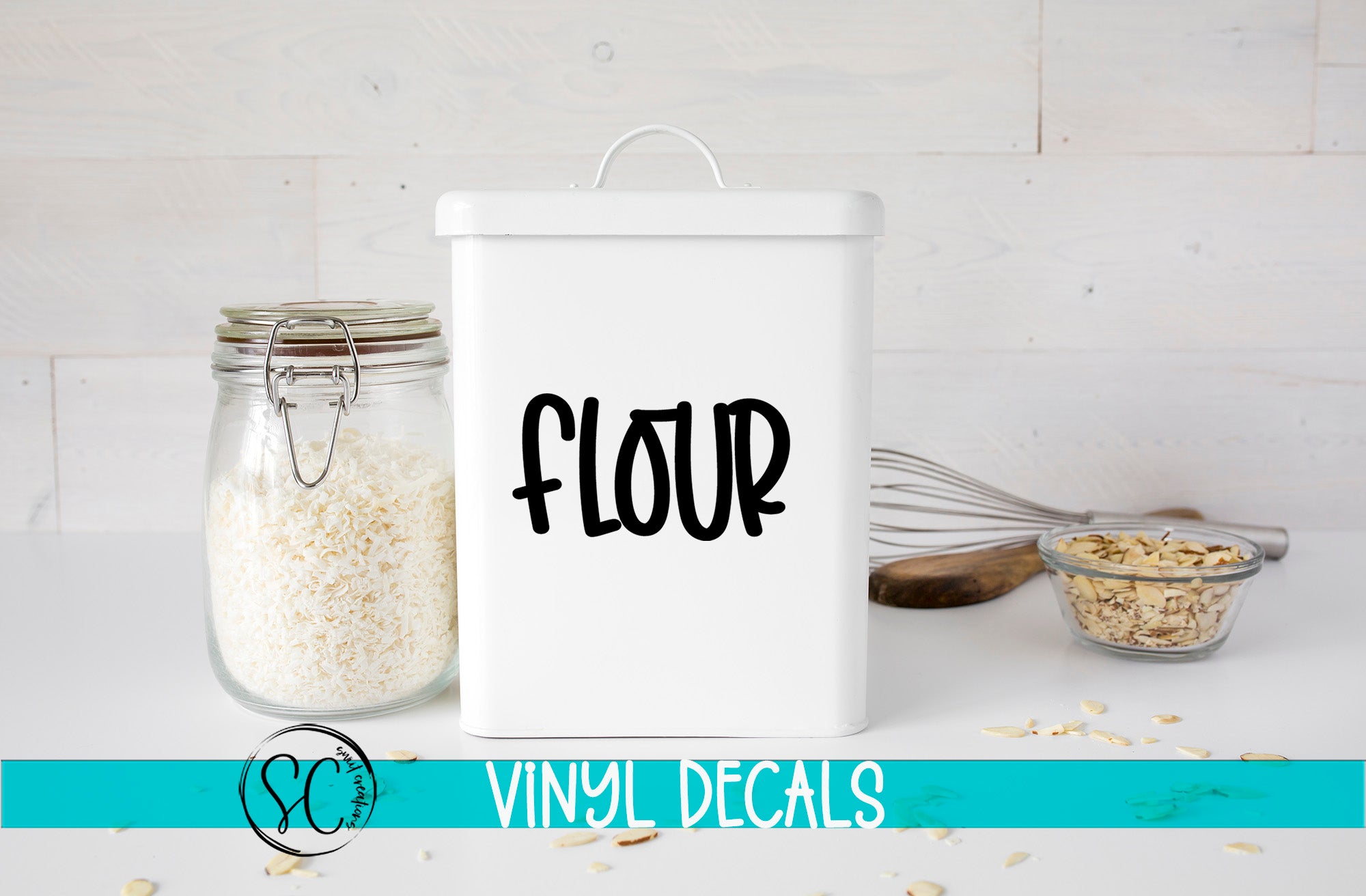 a white canister with the word flour next to it