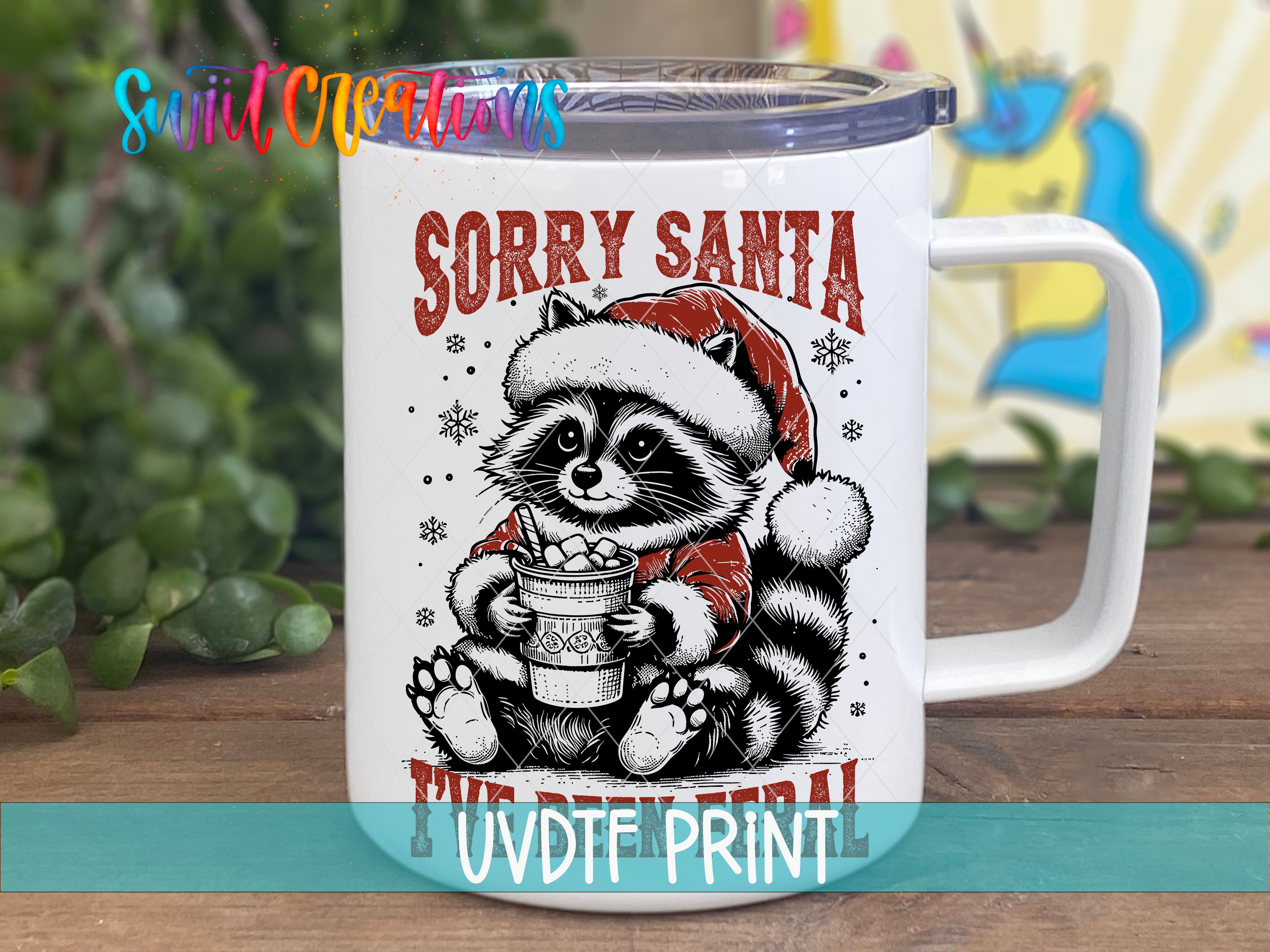 a white coffee mug with a raccoon wearing a santa hat