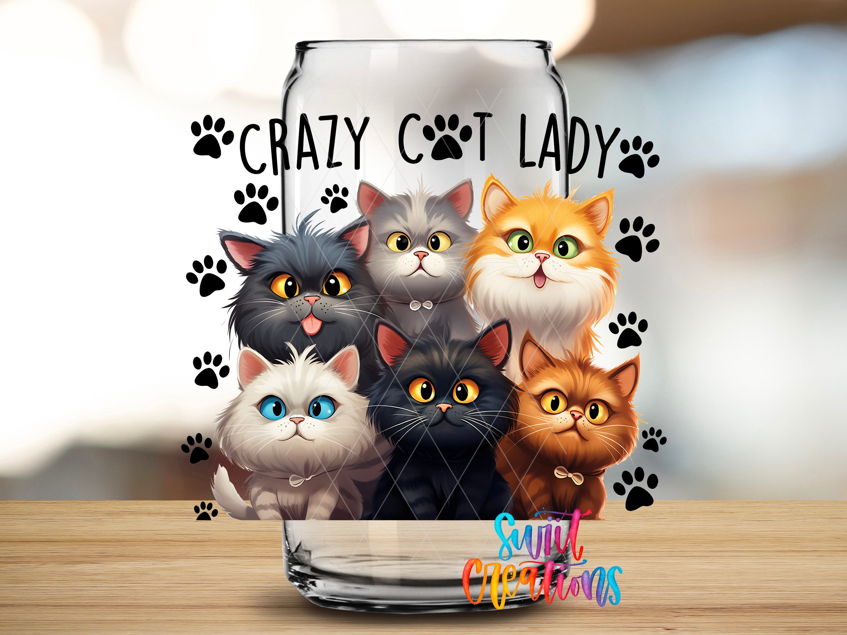 A glass jar with a design featuring a group of cartoon cats, with the text "Crazy Cat Lady" written above them.