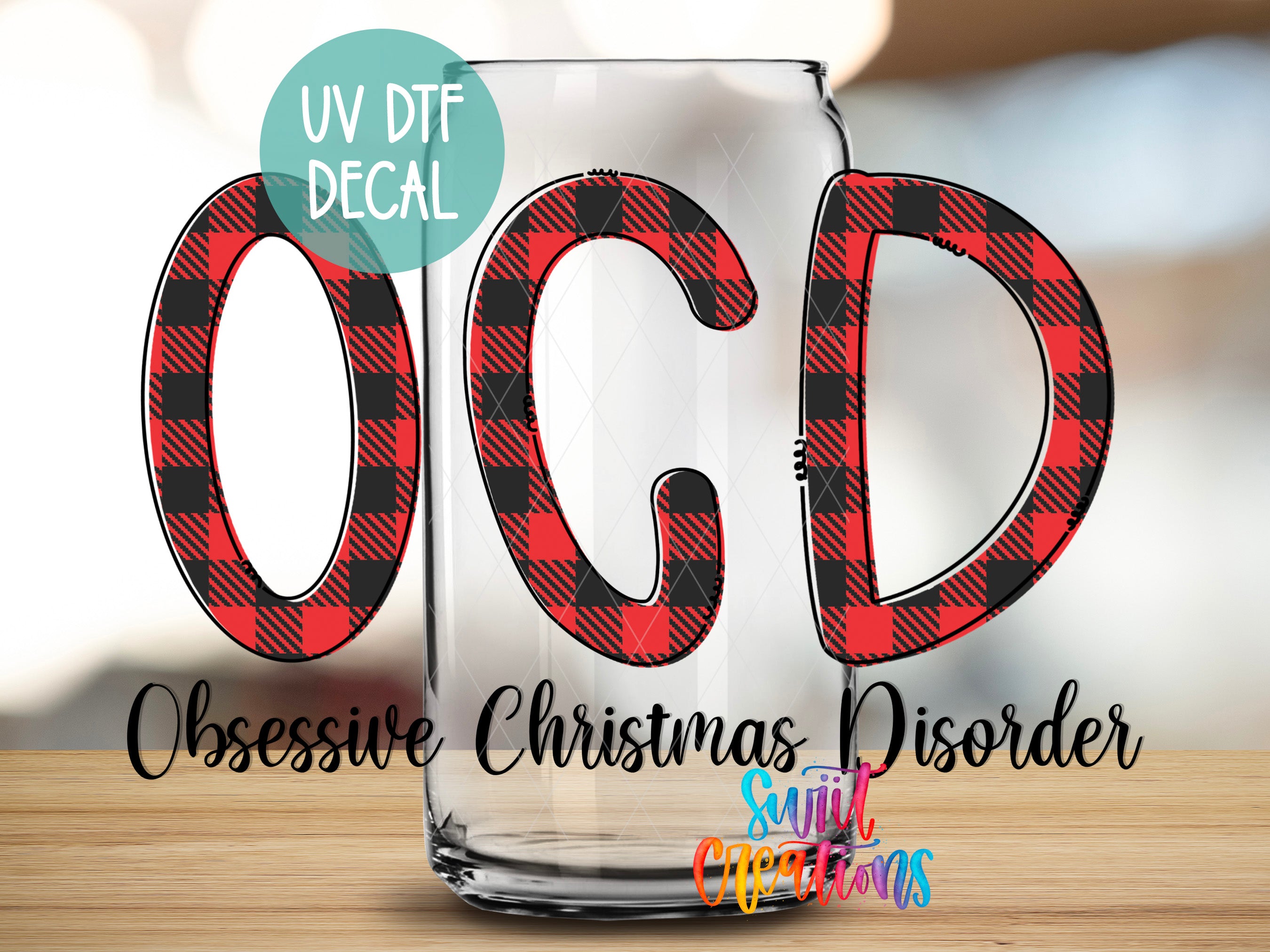 a glass with the text "UV Dtf DECAL" and "OCCUSIVE CHRISTMAS DISORDER" written on it, along with a colorful design of the letters "OCC" and "CD" in red and black plaid patterns.