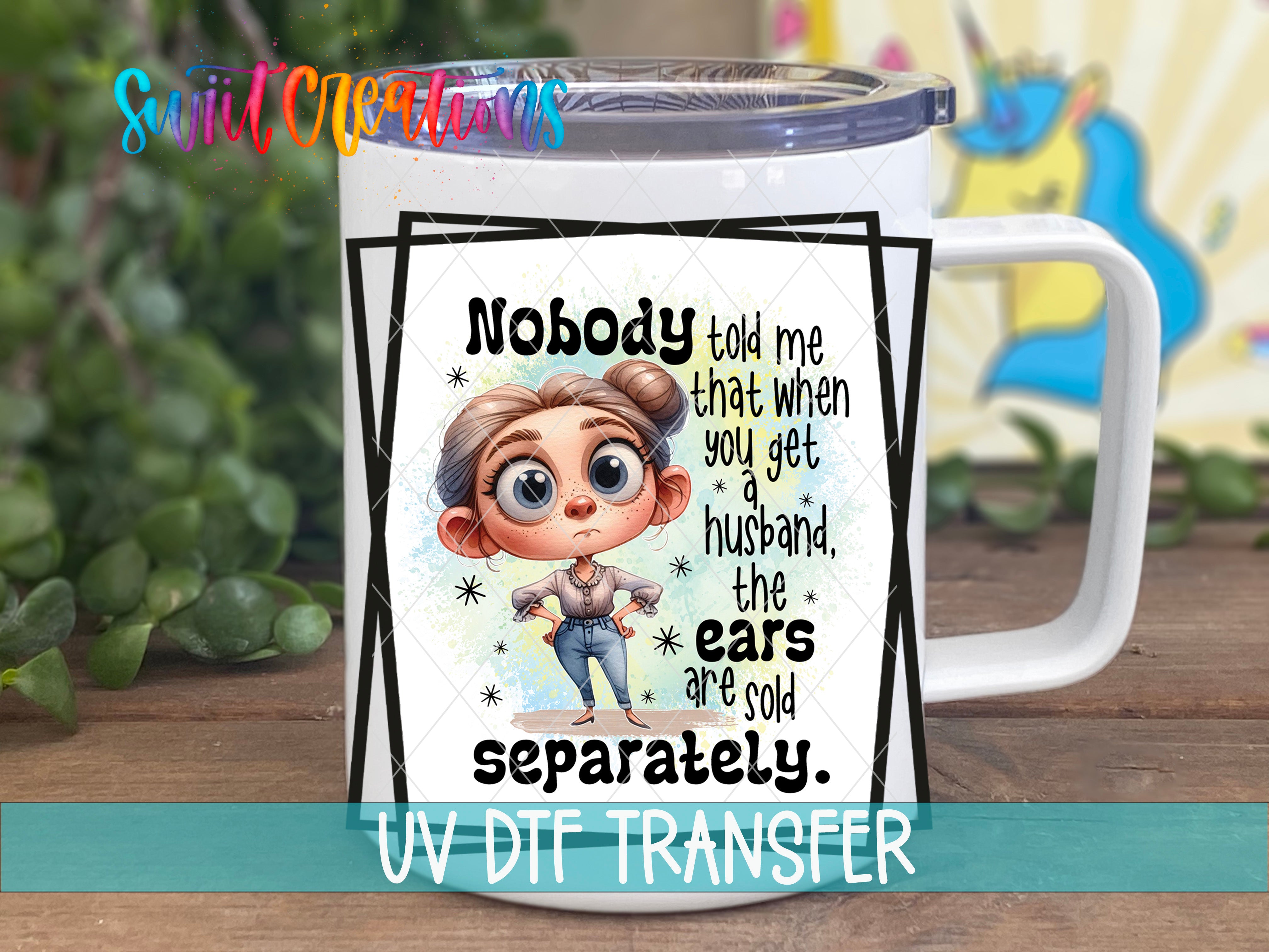 Swiit Creations UV DTF Husband’s Ears Sold Separately transfer displayed on a white coffee mug