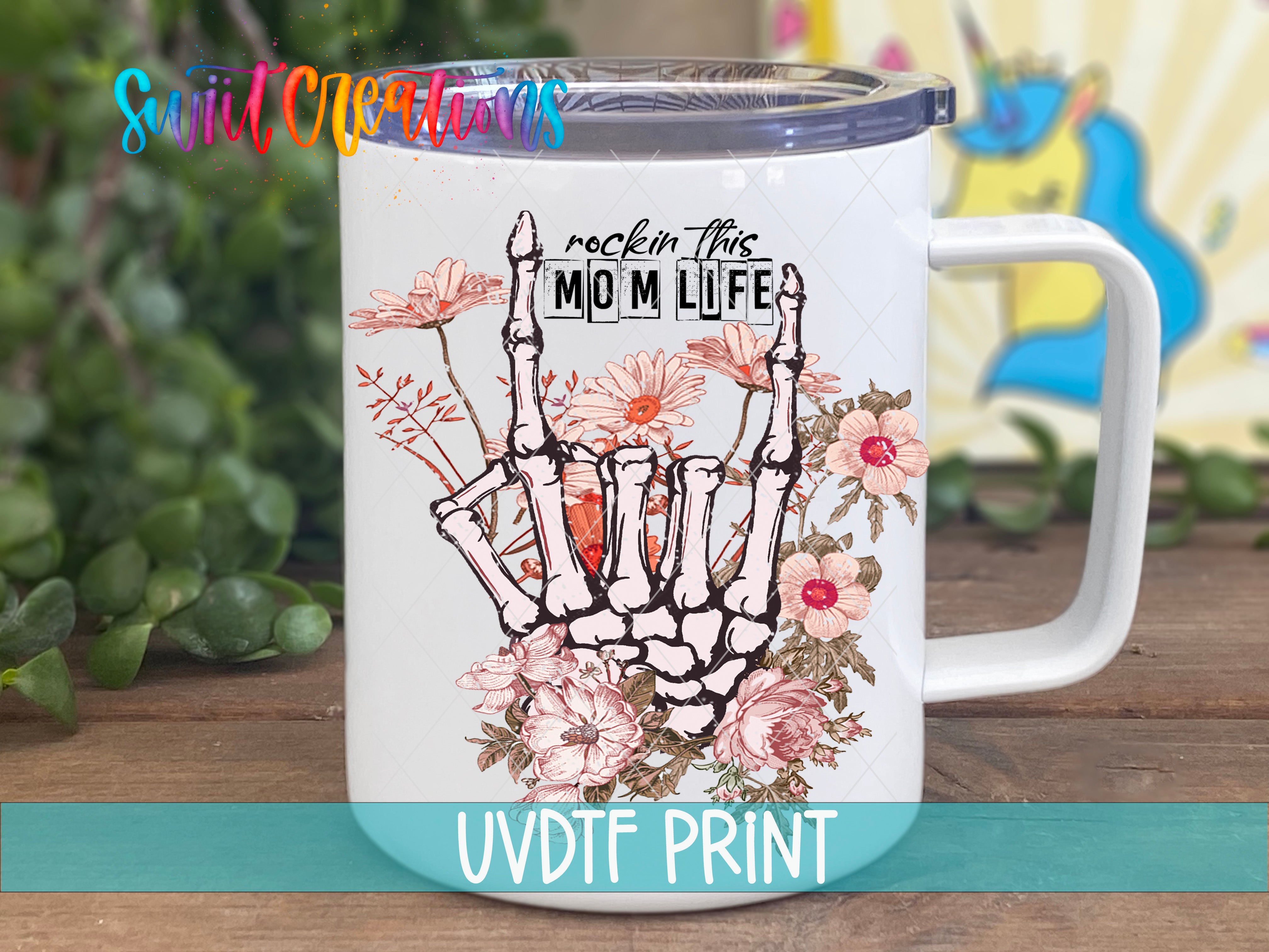 a white coffee mug with a hand holding flowers
