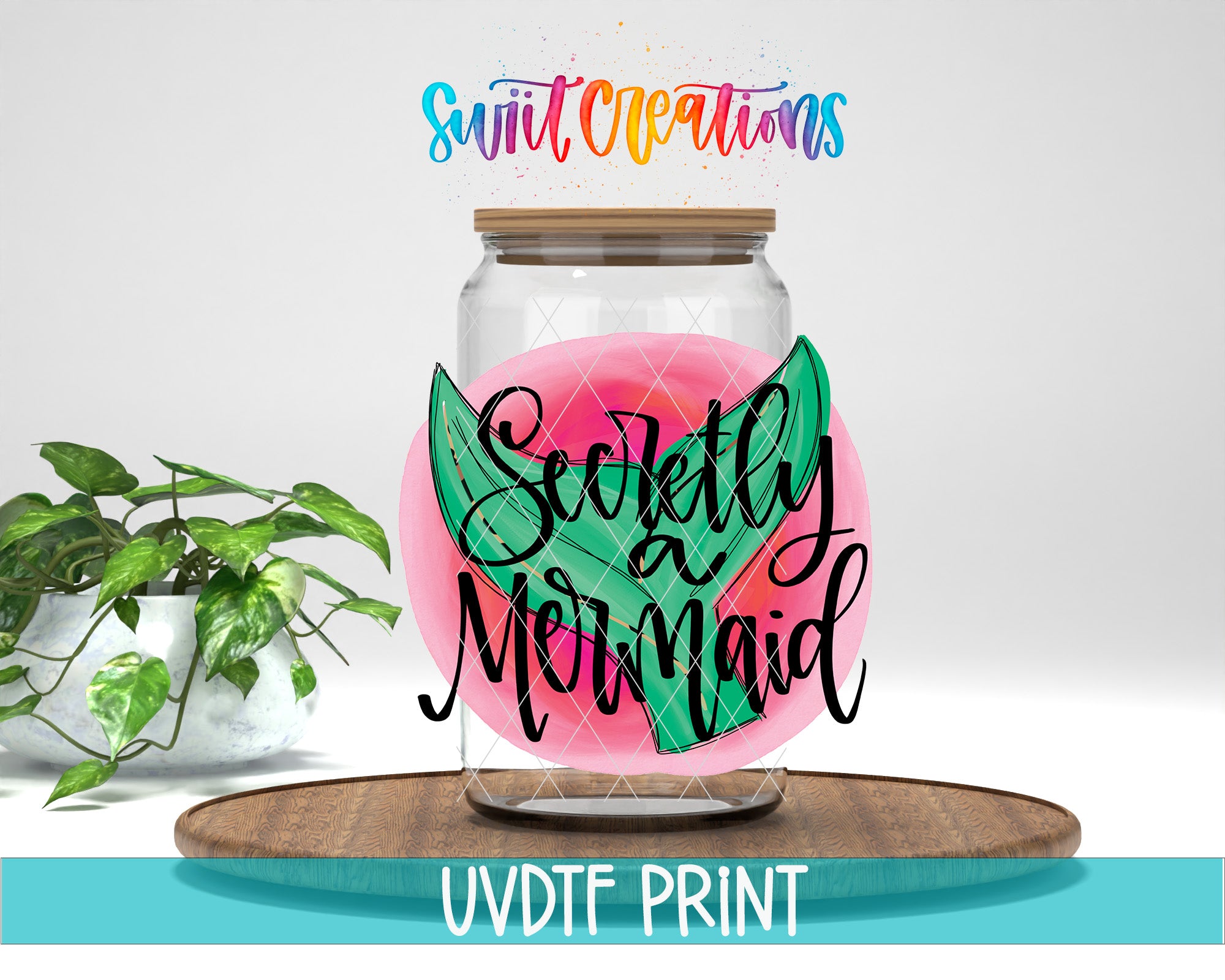 a glass jar with a paper cut out of it sitting on top of a wooden