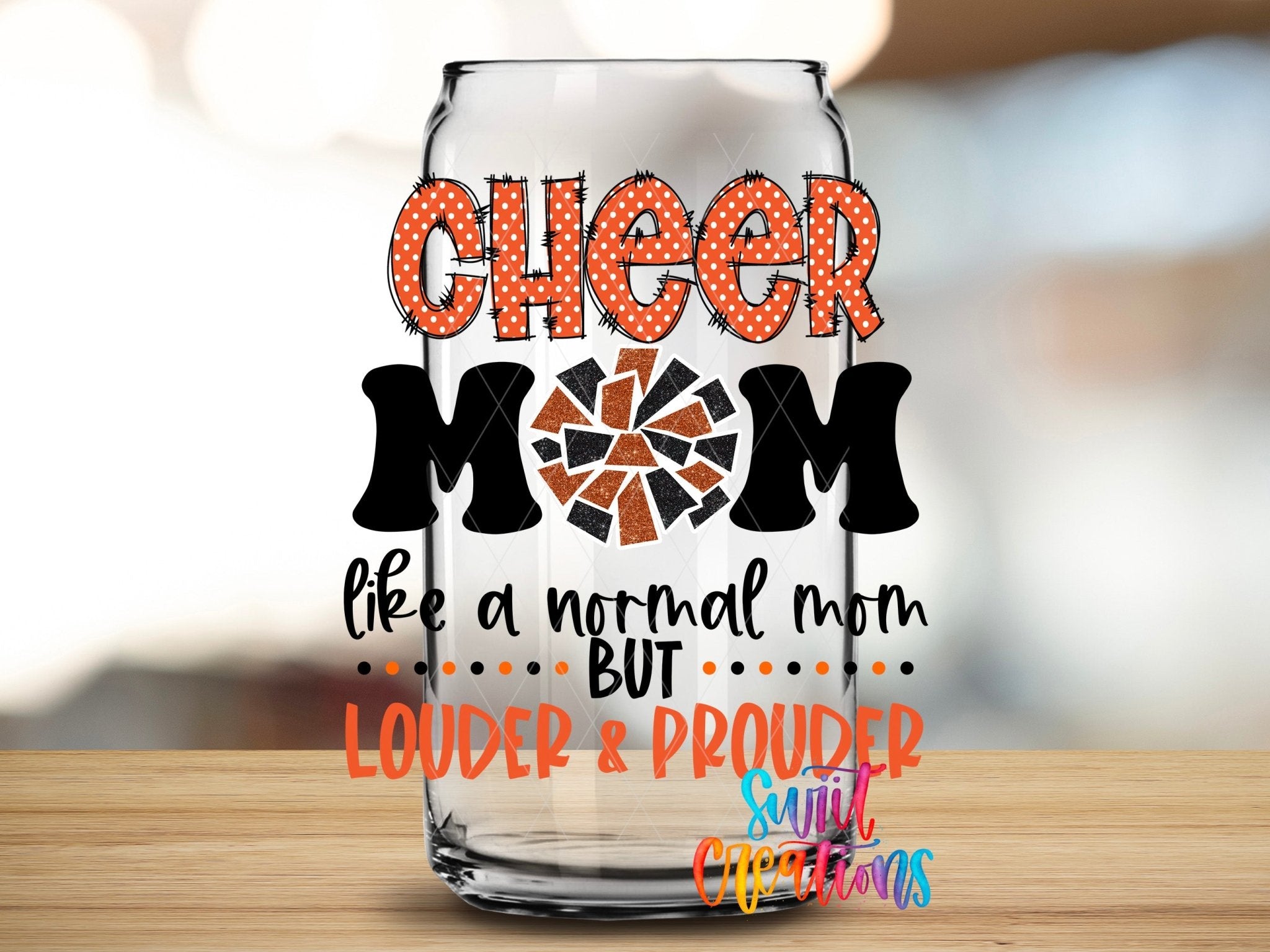 Cheer Mom Orange Louder and Prouder UV DTF transfer applied to a clear glass can from Swiit Creations