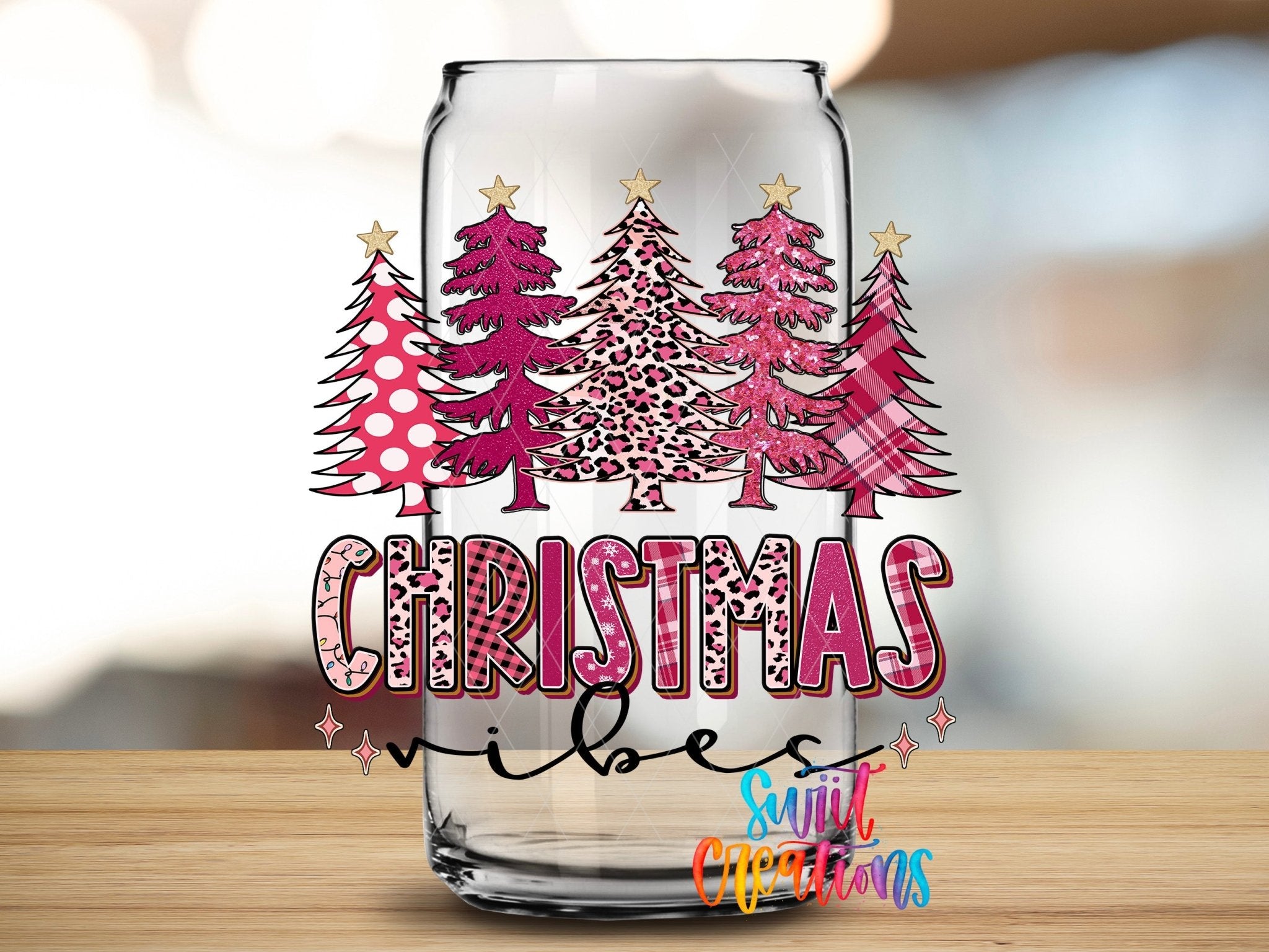 Christmas Vibes UV DTF transfer applied to a clear glass can from Swiit Creations