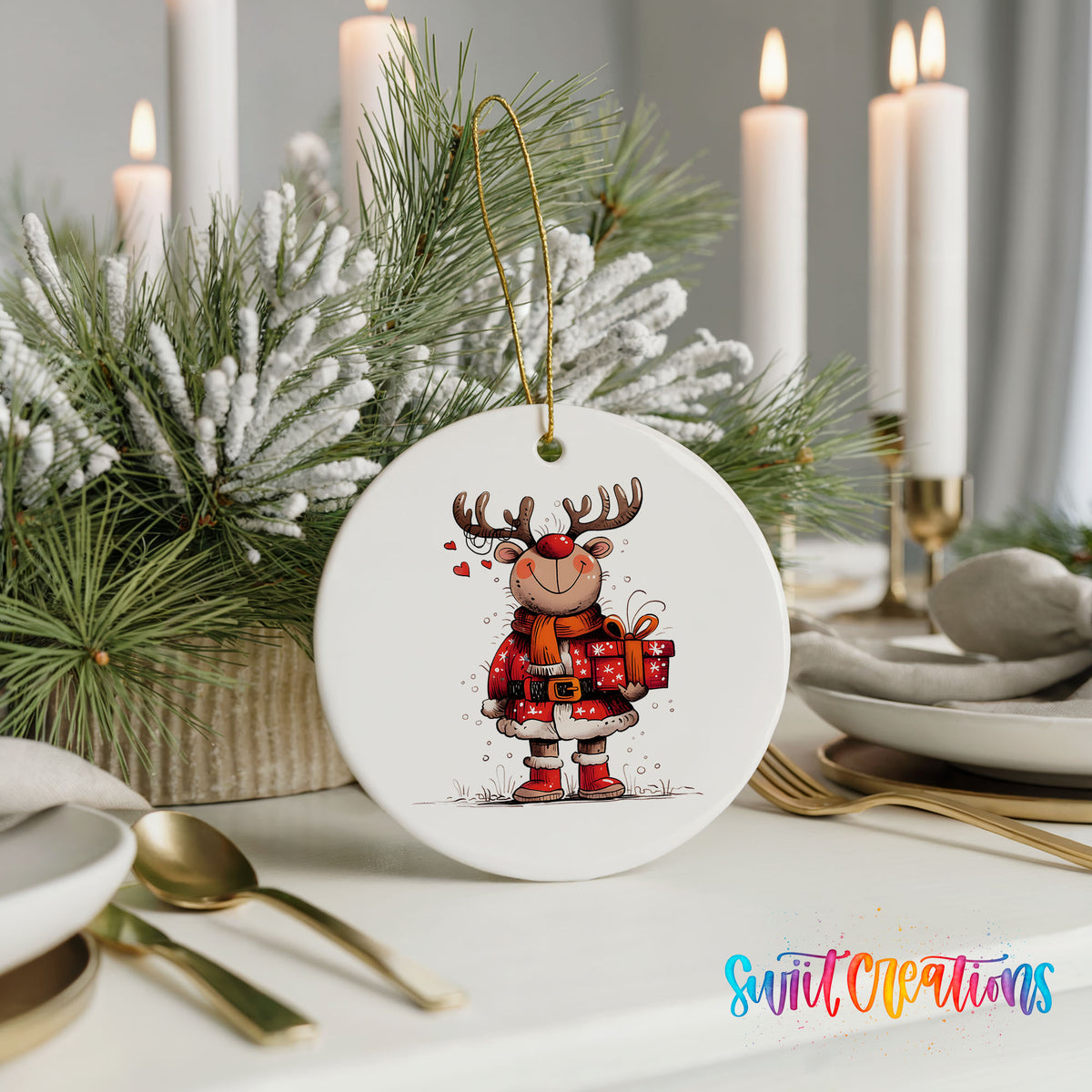 Round ceramic Christmas ornament featuring cheerful reindeer in a Santa suit holding wrapped Christmas gifts, styled with elegant holiday table decor