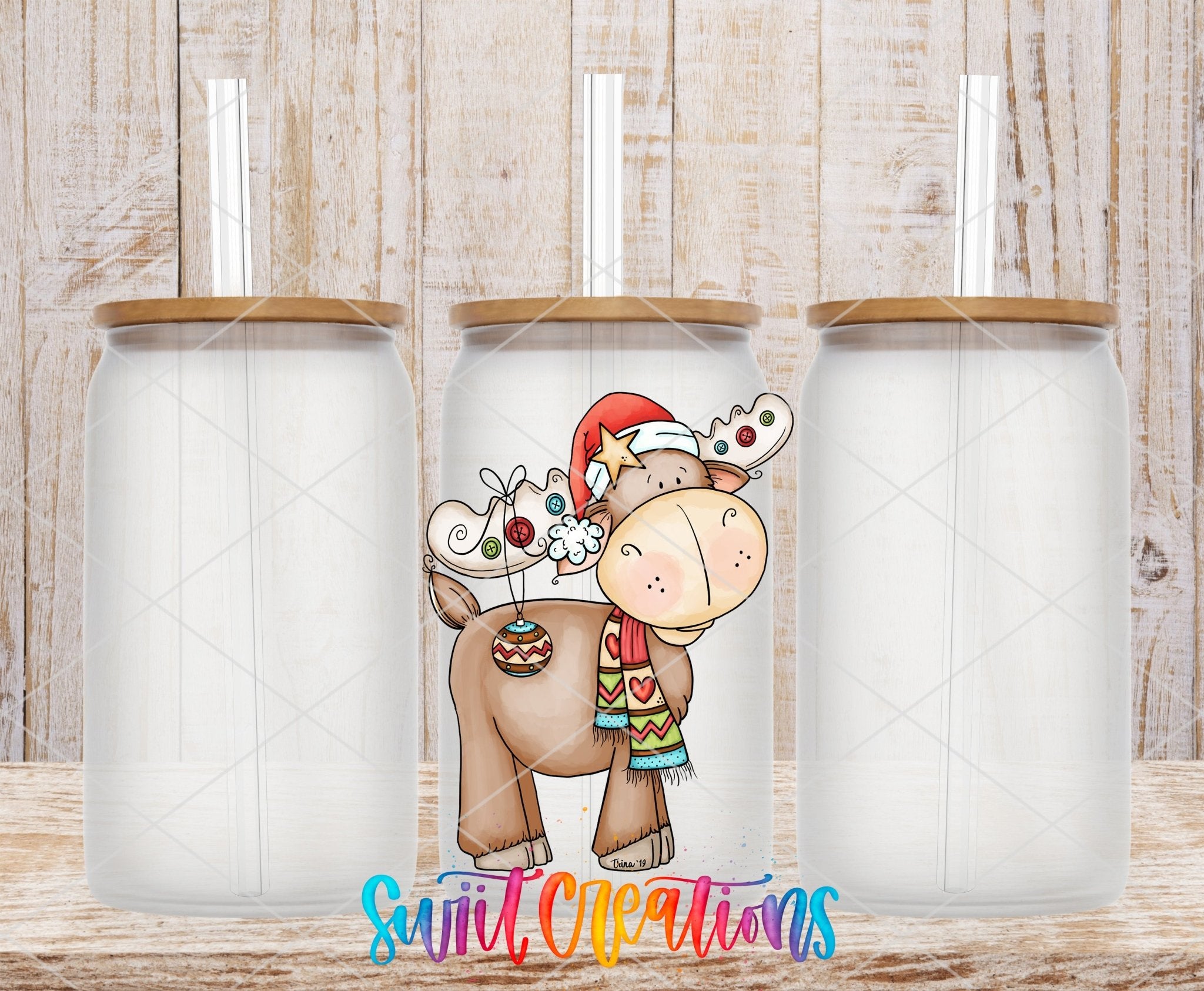 Three clear glass cans with the Cute Christmas Moose UV DTF transfer by Swiit Creations