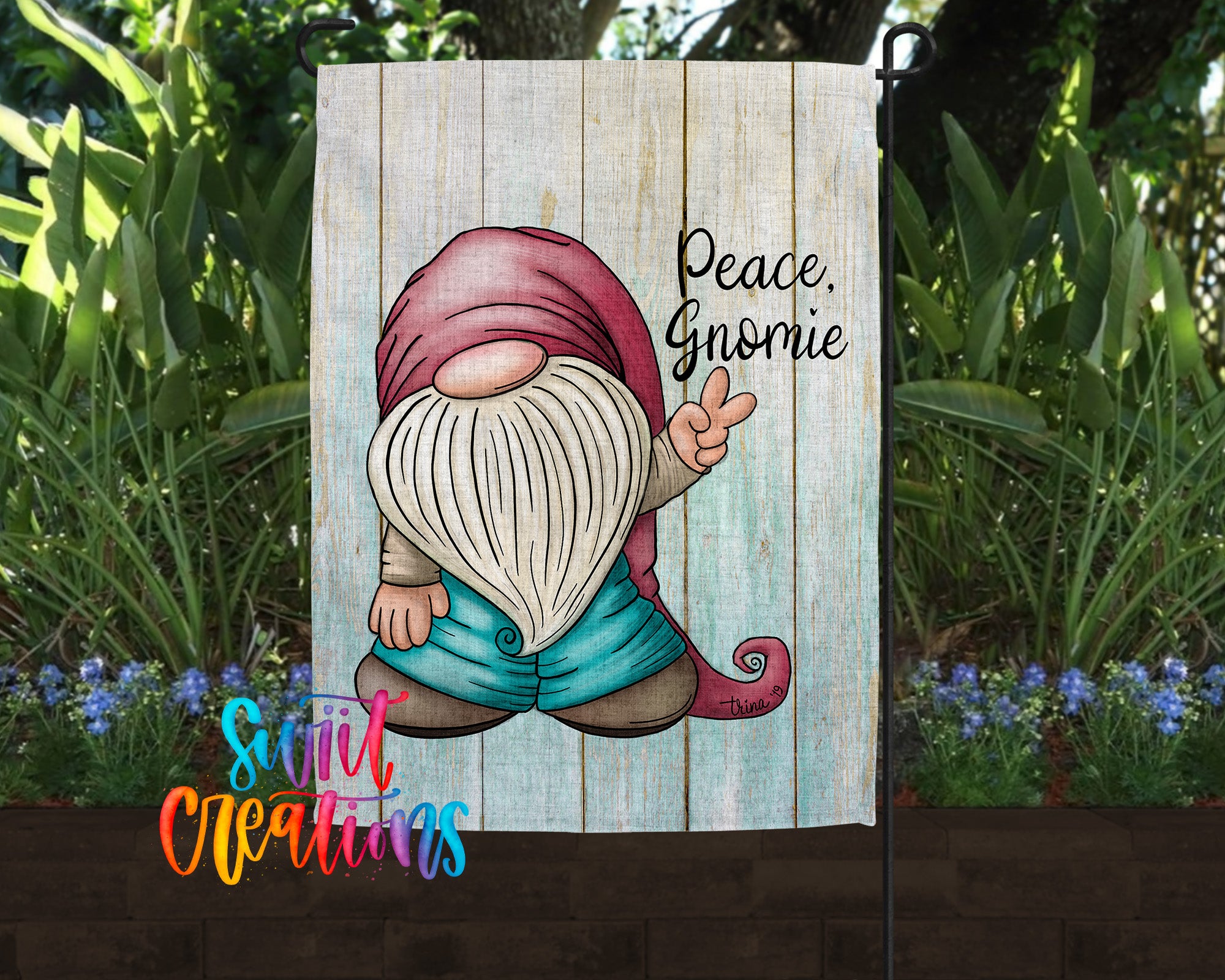 A garden gnome with a peace sign is depicted on a wooden sign, surrounded by greenery and flowers.