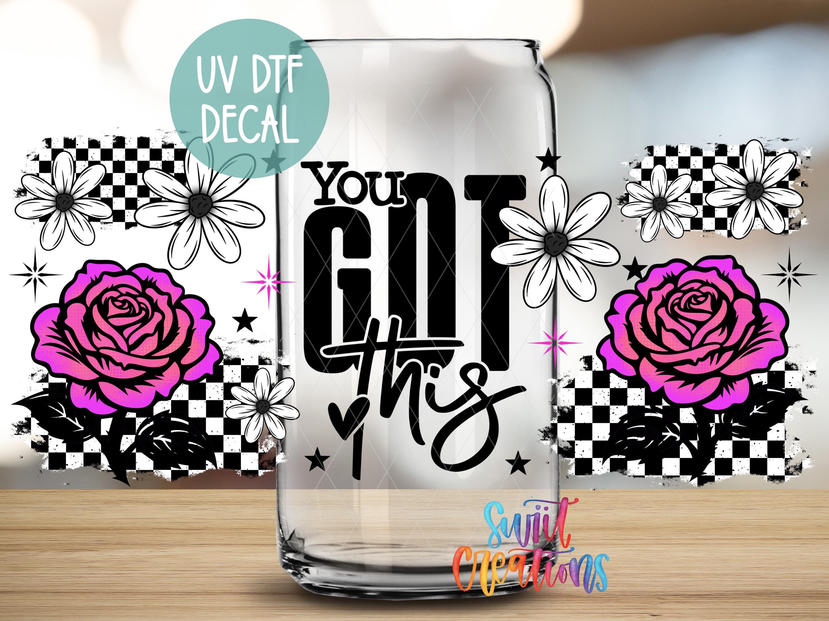 a clear glass with a UV decal that says "You Got This" surrounded by various floral and star designs.