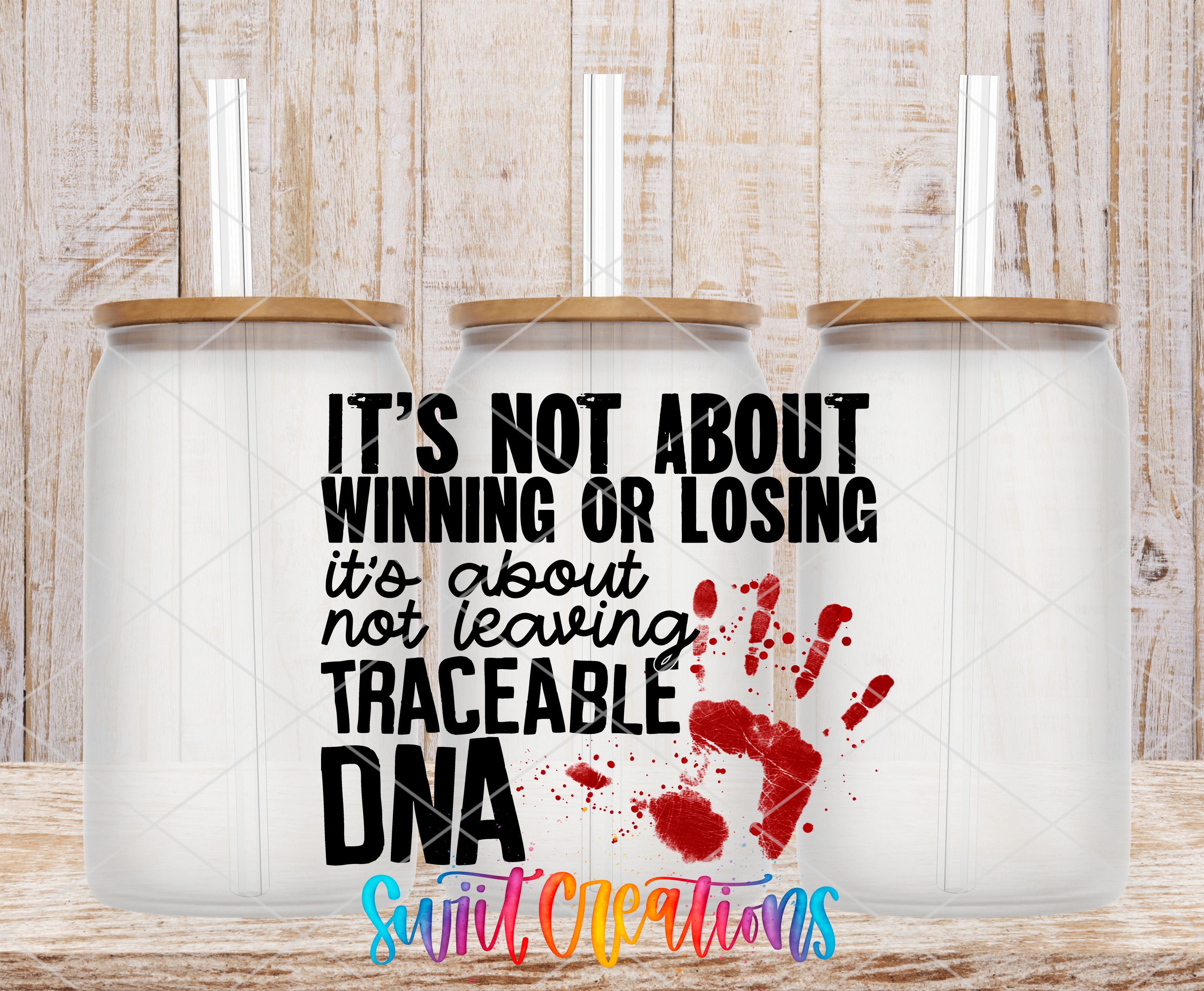Three clear glass cans with the Traceable DNA True Crime UV DTF transfer by Swiit Creations