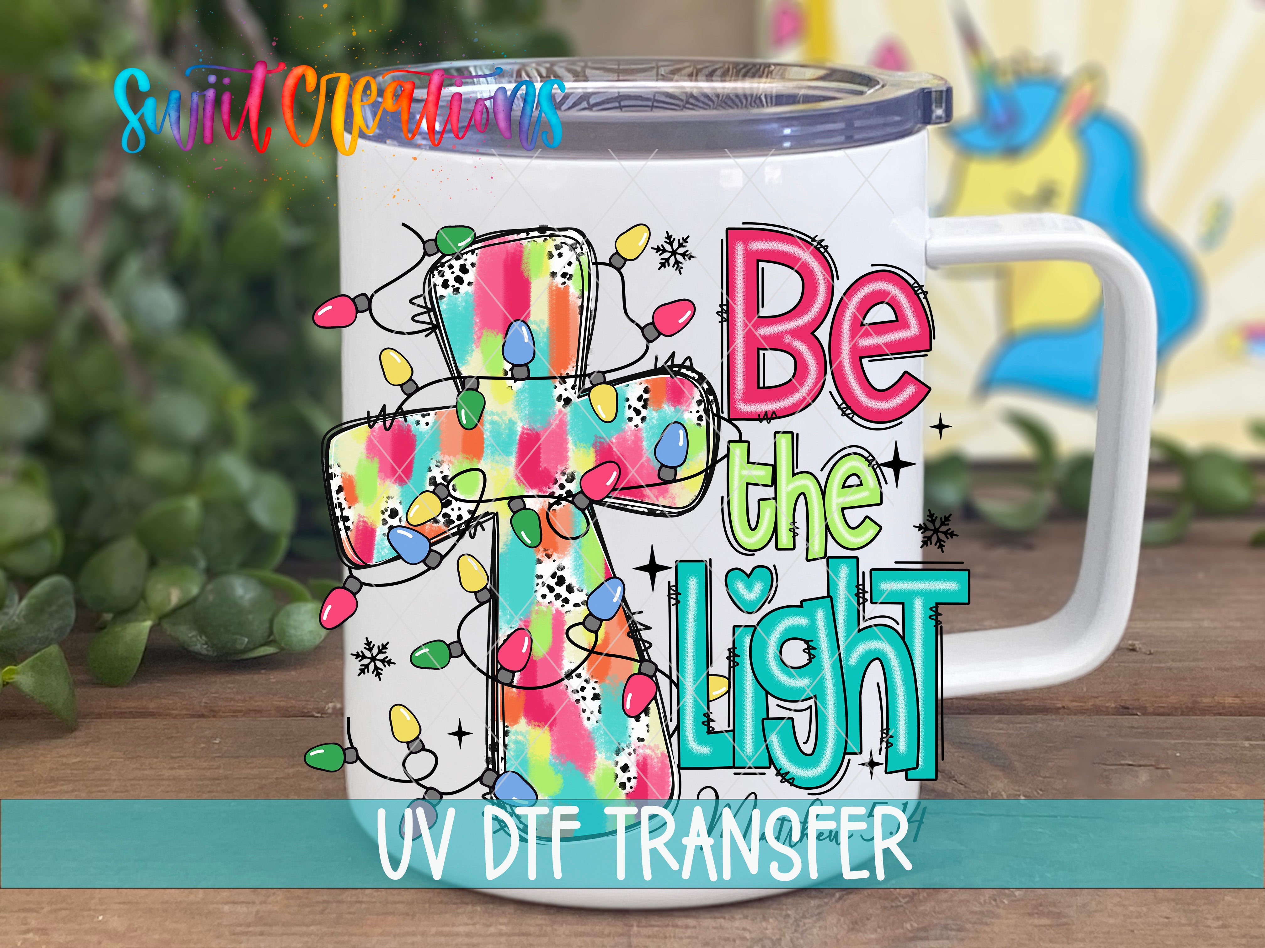 Swiit Creations UV DTF Be the Light Christian transfer displayed on a white coffee mug