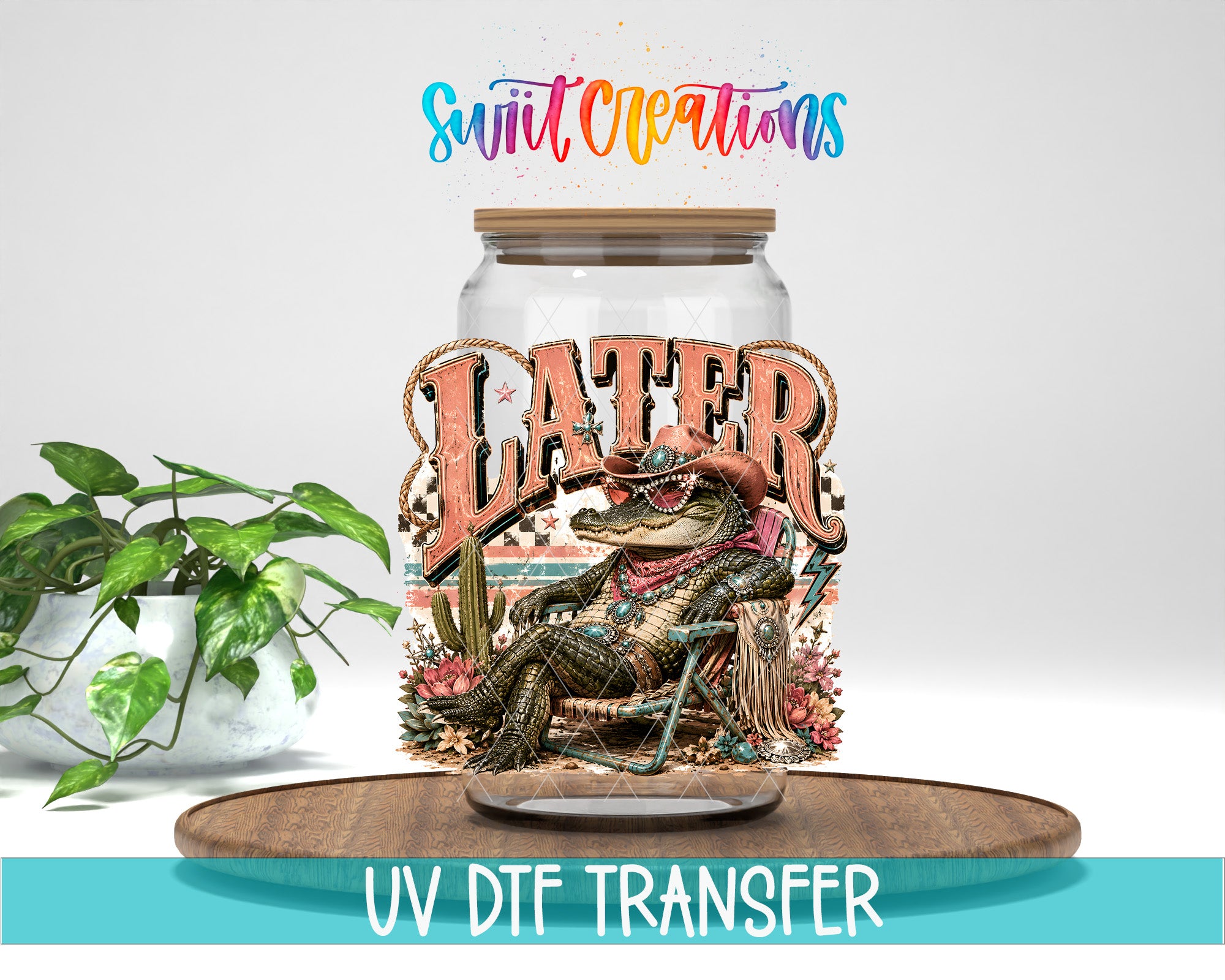 a glass jar with a colorful illustration of a crocodile or alligator sitting in a chair, surrounded by various plants and flowers. The text "LATER" is prominently displayed on the jar, and the phrase "UV DFT Transfer" is written below the image.