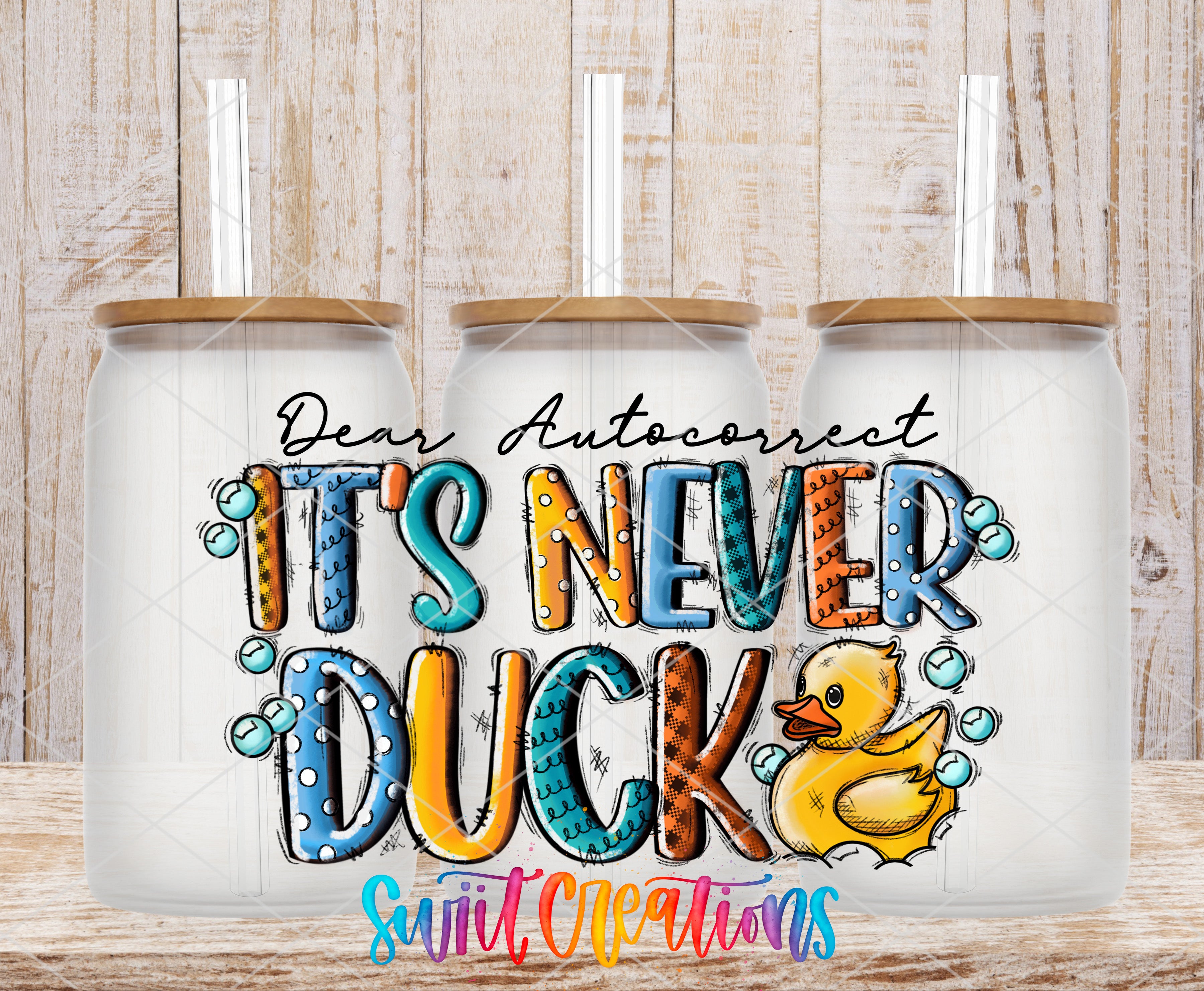 three glass jars with a colorful and playful design. The jars are labeled with the phrase "It's Never Duck" and have a rubber duck illustration. The text "Dear Auto correct" is also present, suggesting a humorous take on the concept of auto-corRECTION.