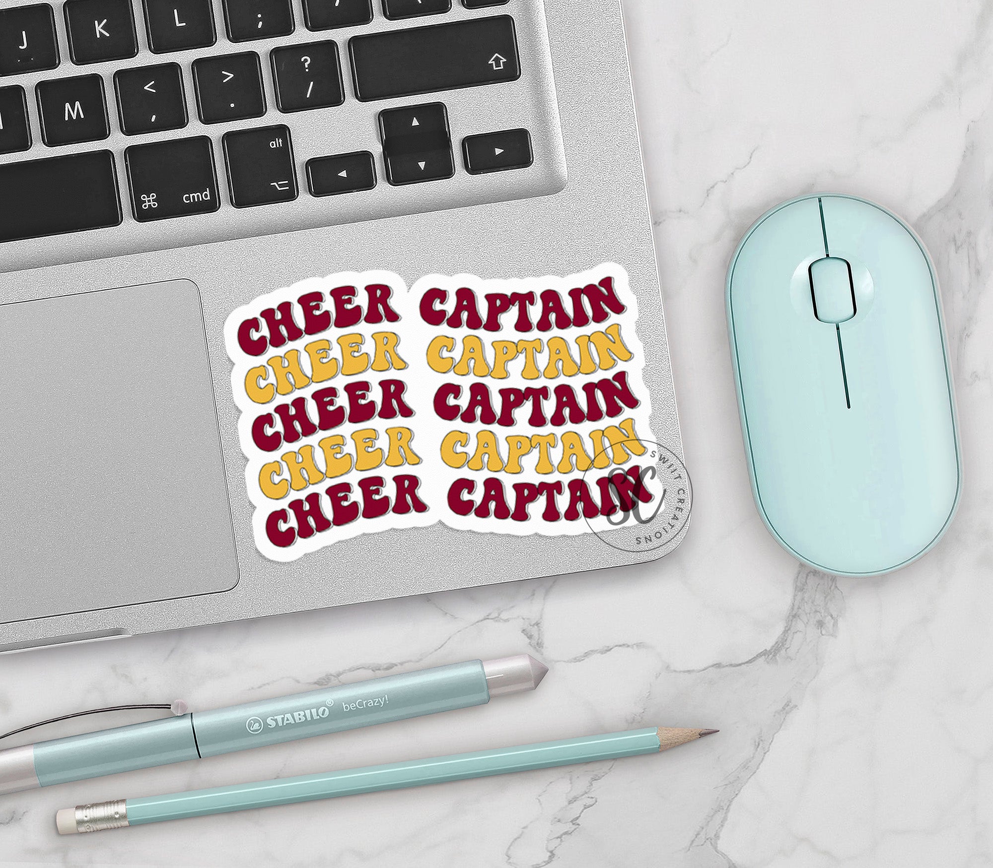 a laptop computer sitting on top of a desk next to a mouse