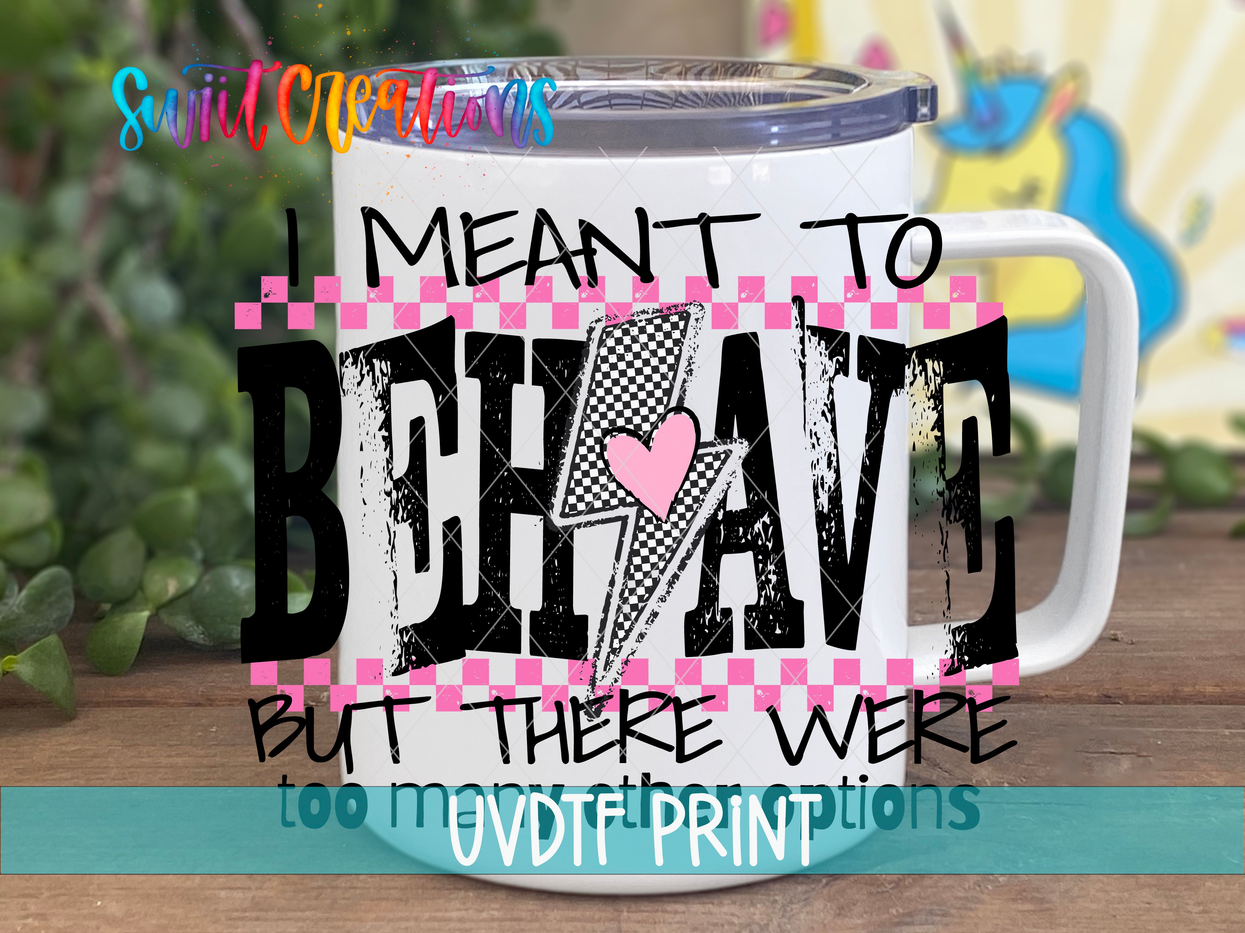 A white mug with a colorful graphic design and text on it, placed on a wooden surface.