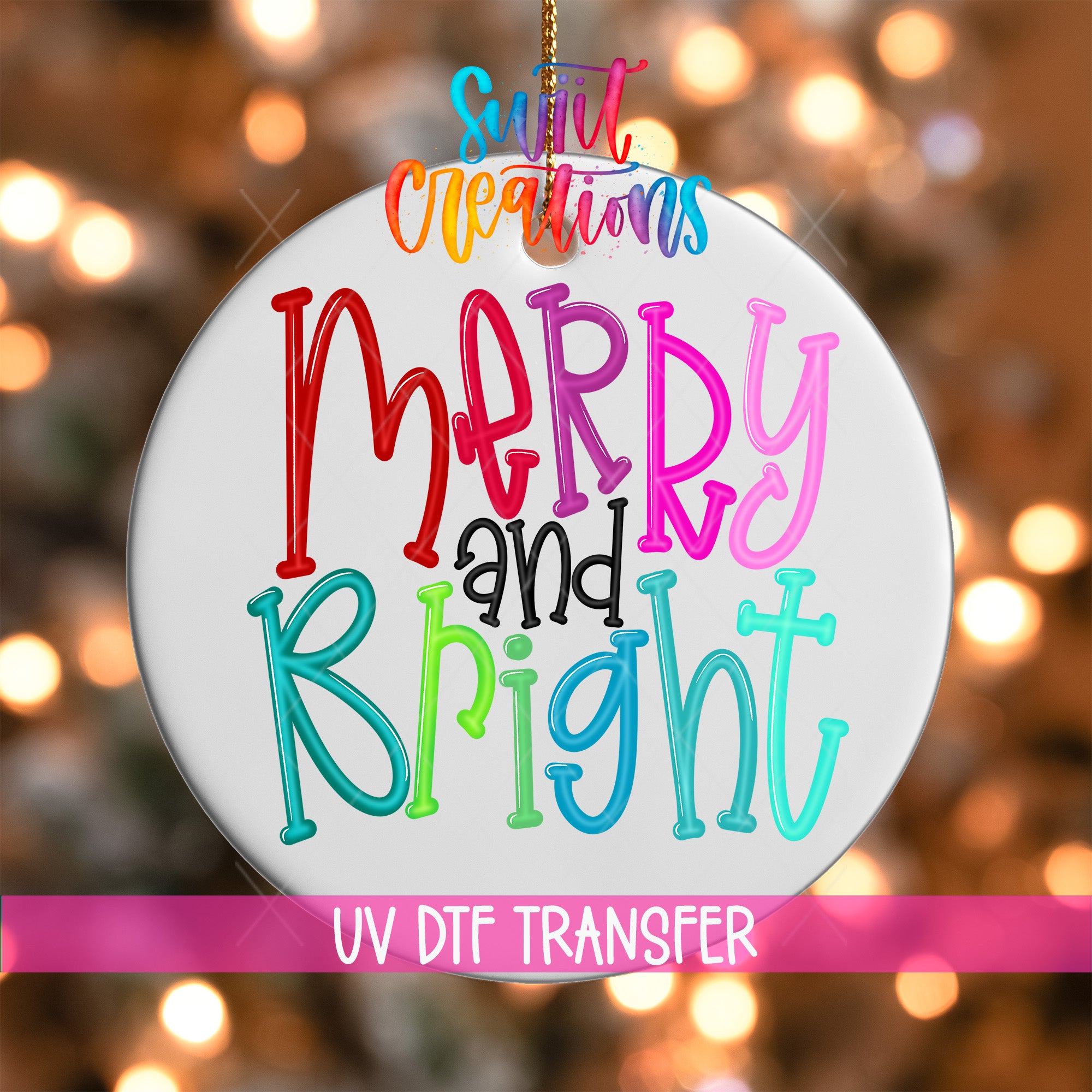 A colorful ornament with the text "Merry and Bright" written on it, hanging against a background of blurred lights.