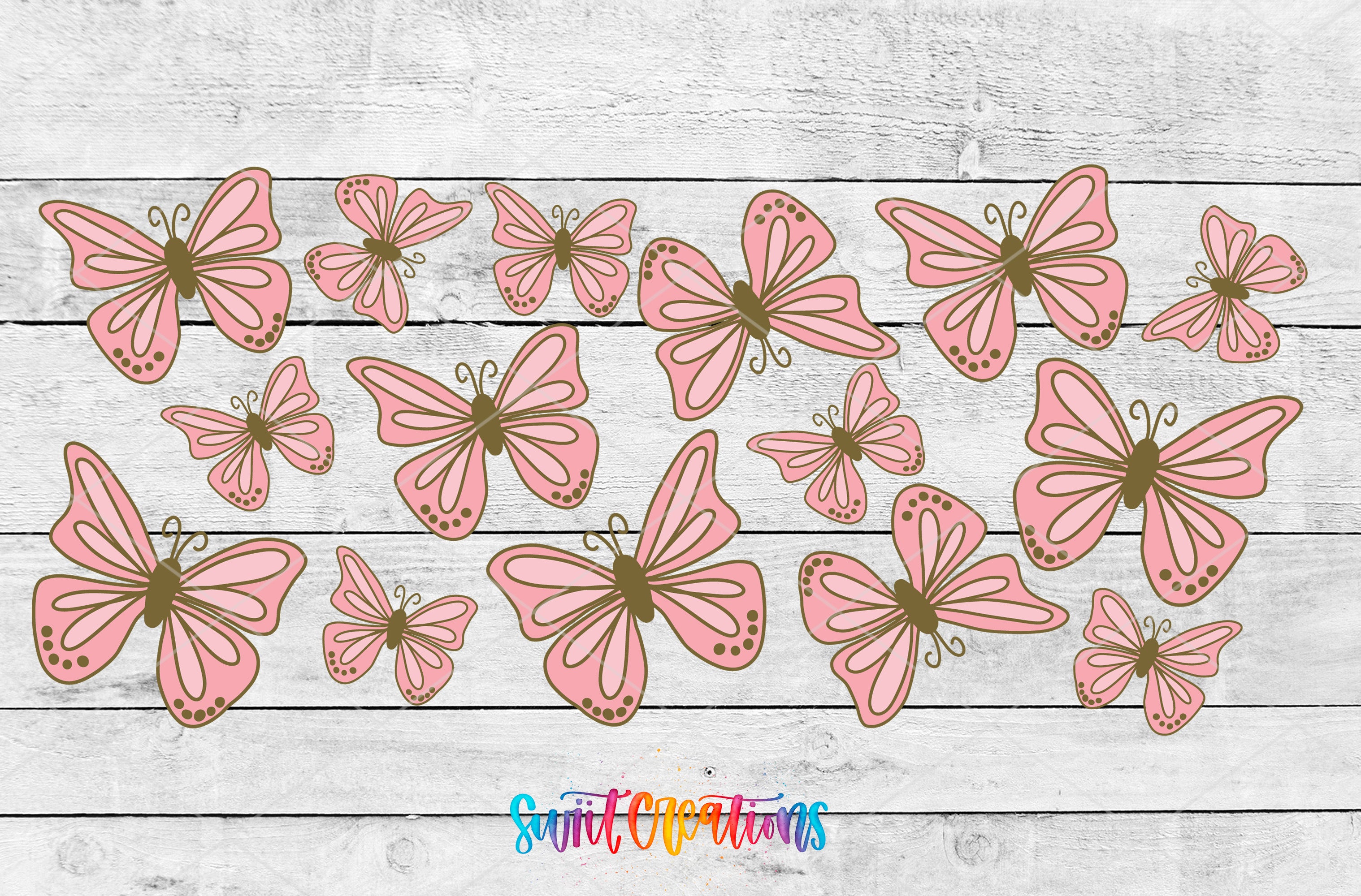 a collection of pink and brown butterflies arranged on a wooden background.