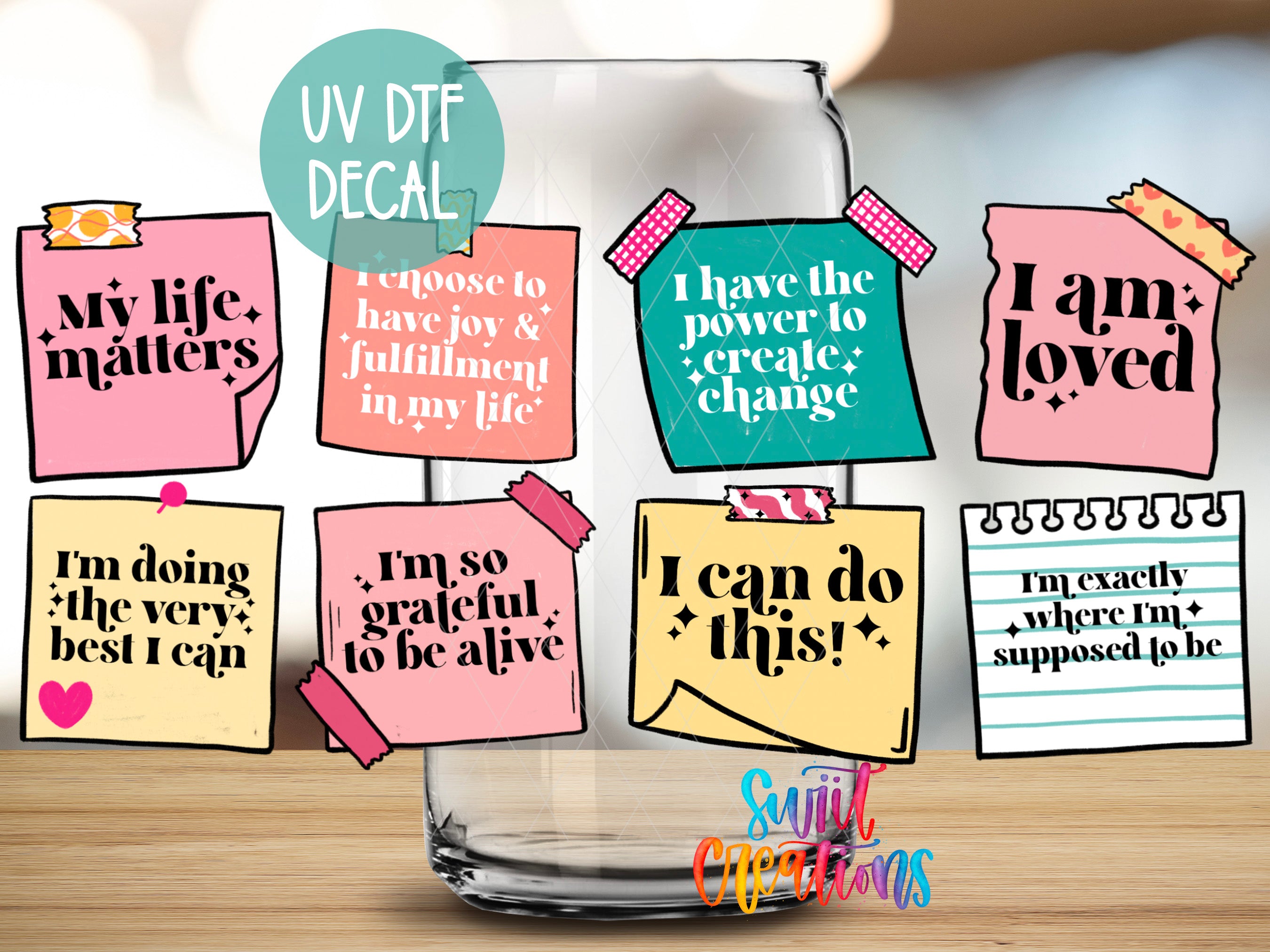 a glass jar with various motivational notes and stickers attached to it, along with a UV decal.