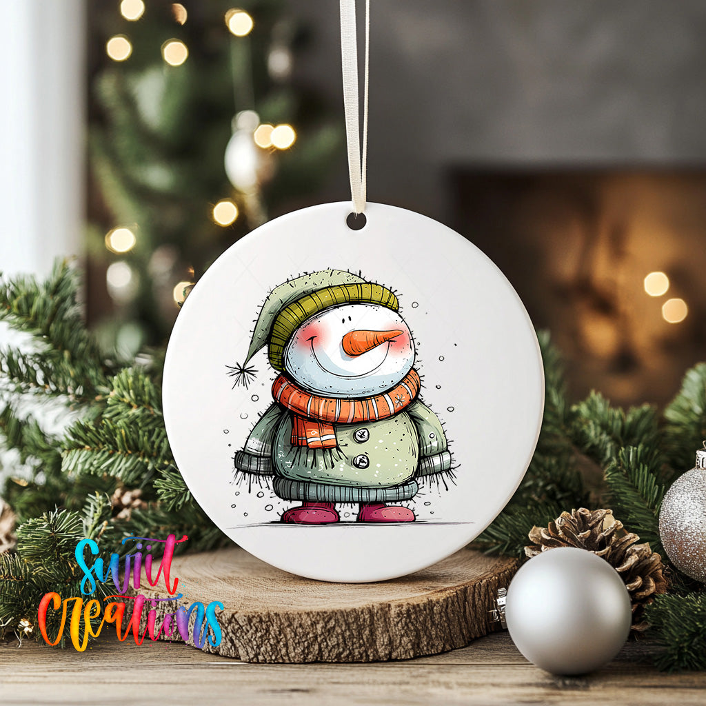 A white ceramic ornament featuring a snowman with a scarf and hat, surrounded by Christmas decorations and greenery.