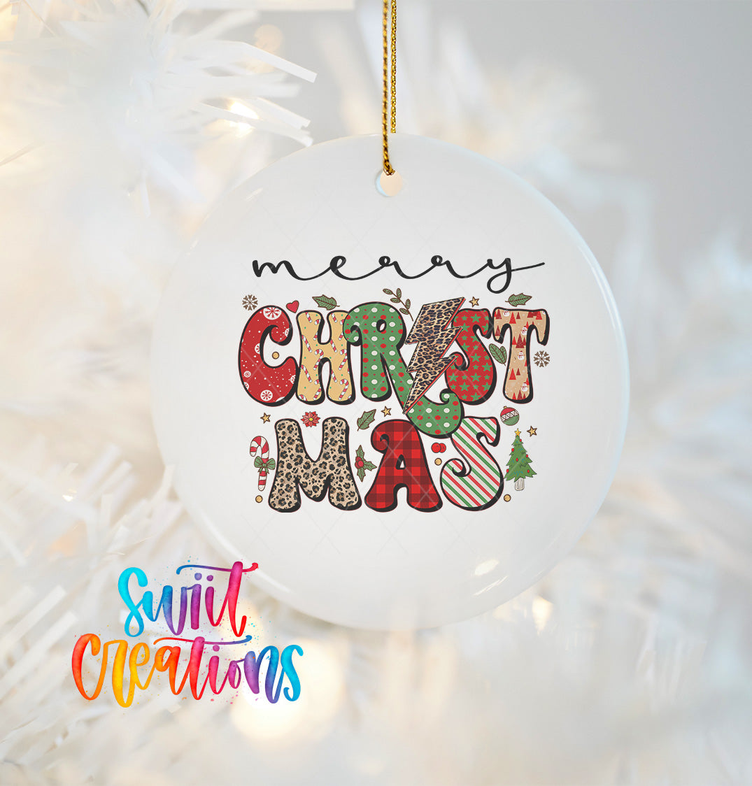 A white Christmas ornament with the text "Merry Christmas" written in a colorful, decorative font.