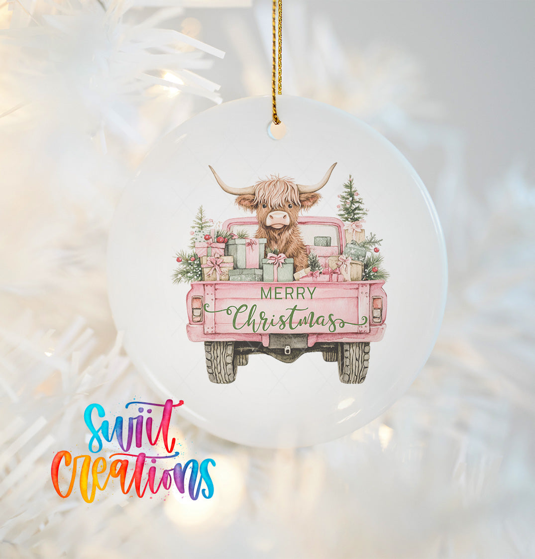 A white Christmas ornament with a pink truck and a cow with horns, along with the text "MERRY CHRISTMAS" on the back of the truck.