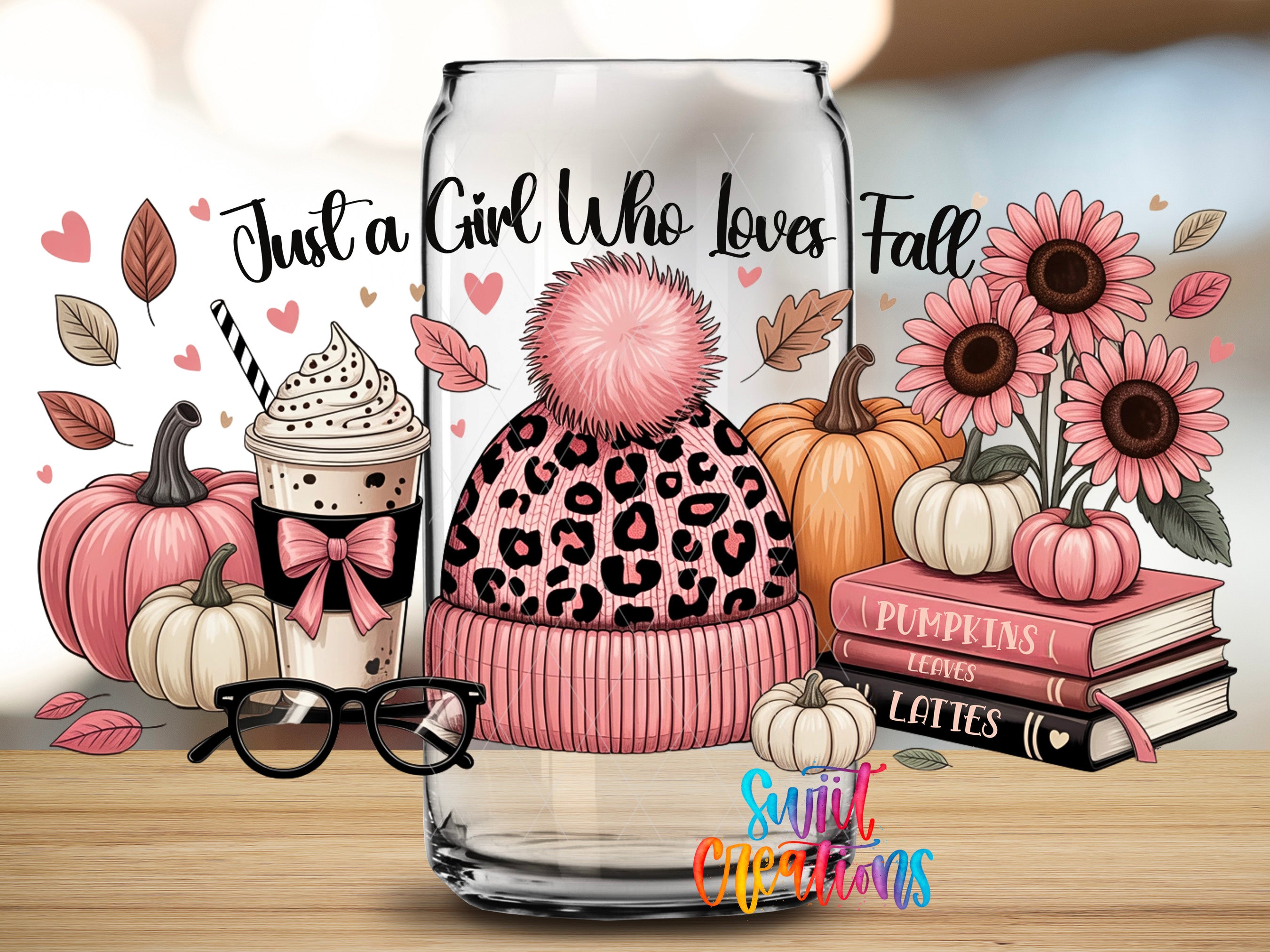 A glass jar filled with various fall-themed items, including a leopard print hat, pumpkins, sunflowers, and books, along with a pair of glasses and a coffee drink.