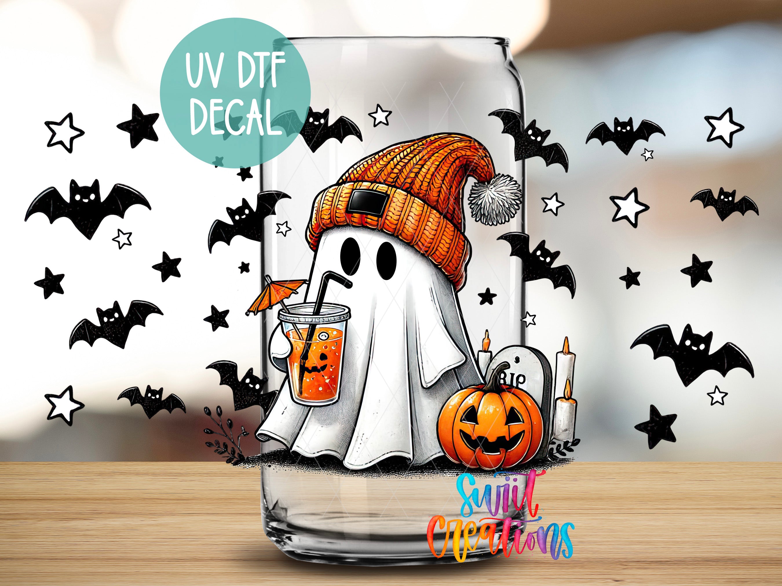 a glass with a picture of a ghost and a pumpkin