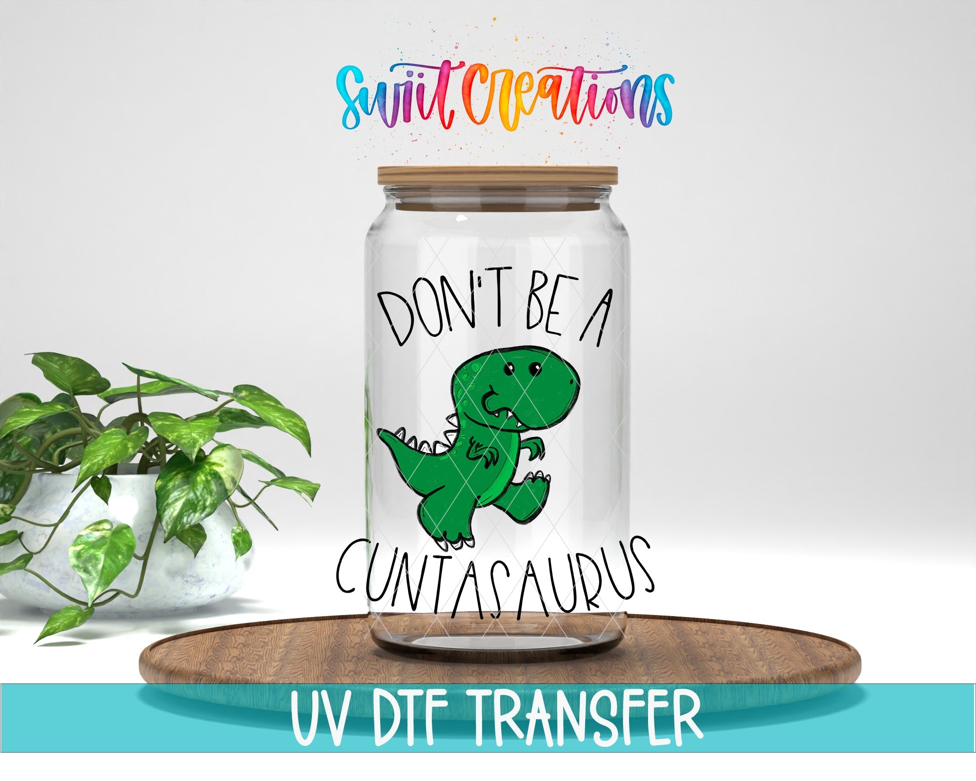 Swiit Creations Don’t Be a Cuntasaurus UV DTF transfer mockup on a glass jar with a funny green dinosaur design.