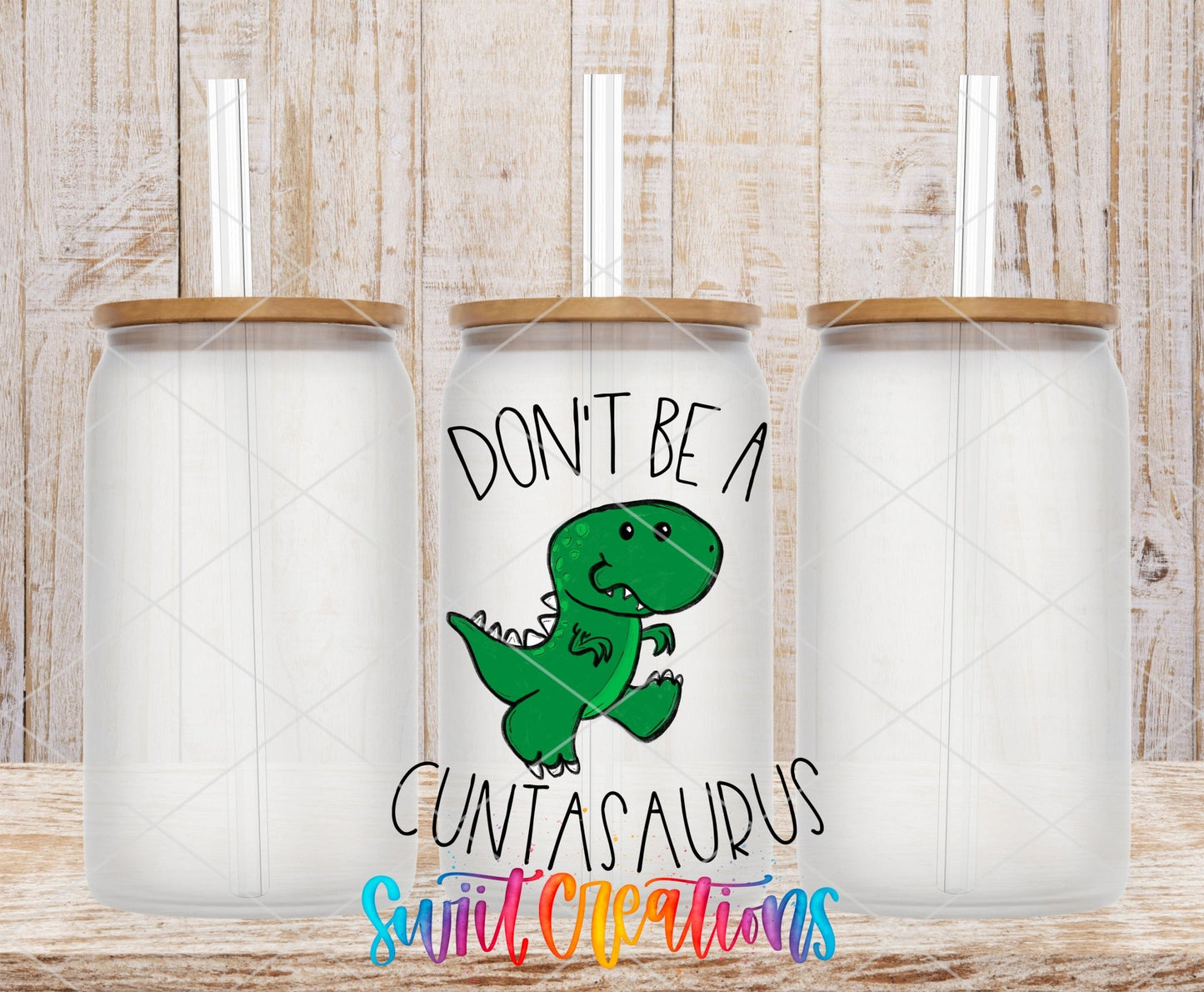 Glass tumbler mockups featuring the Swiit Creations Don’t Be a Cuntasaurus UV DTF transfer and green dinosaur artwork.