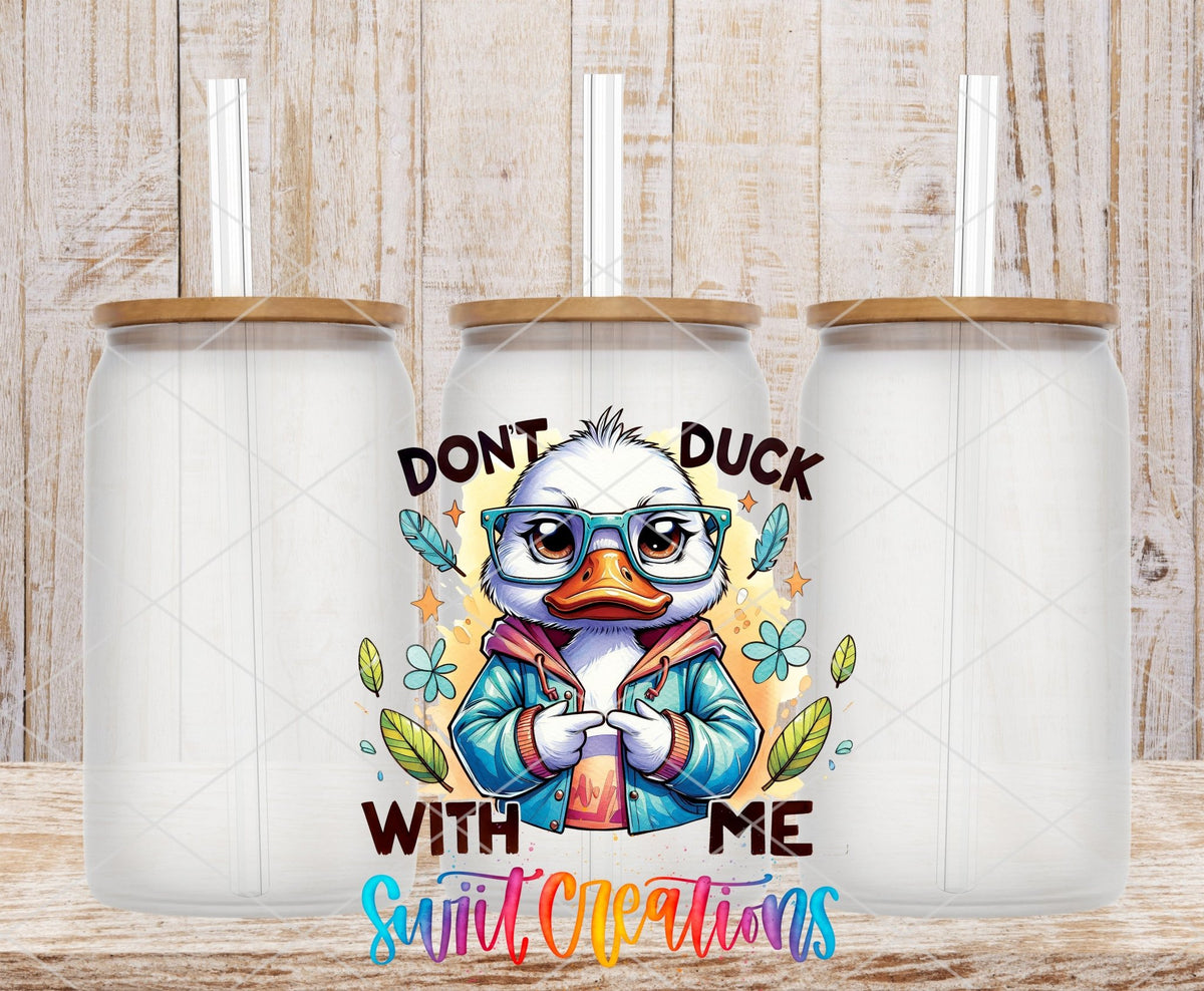 Don't Duck With Me duck in a blue jacket UV DTF transfer on frosted glass cans with bamboo lids