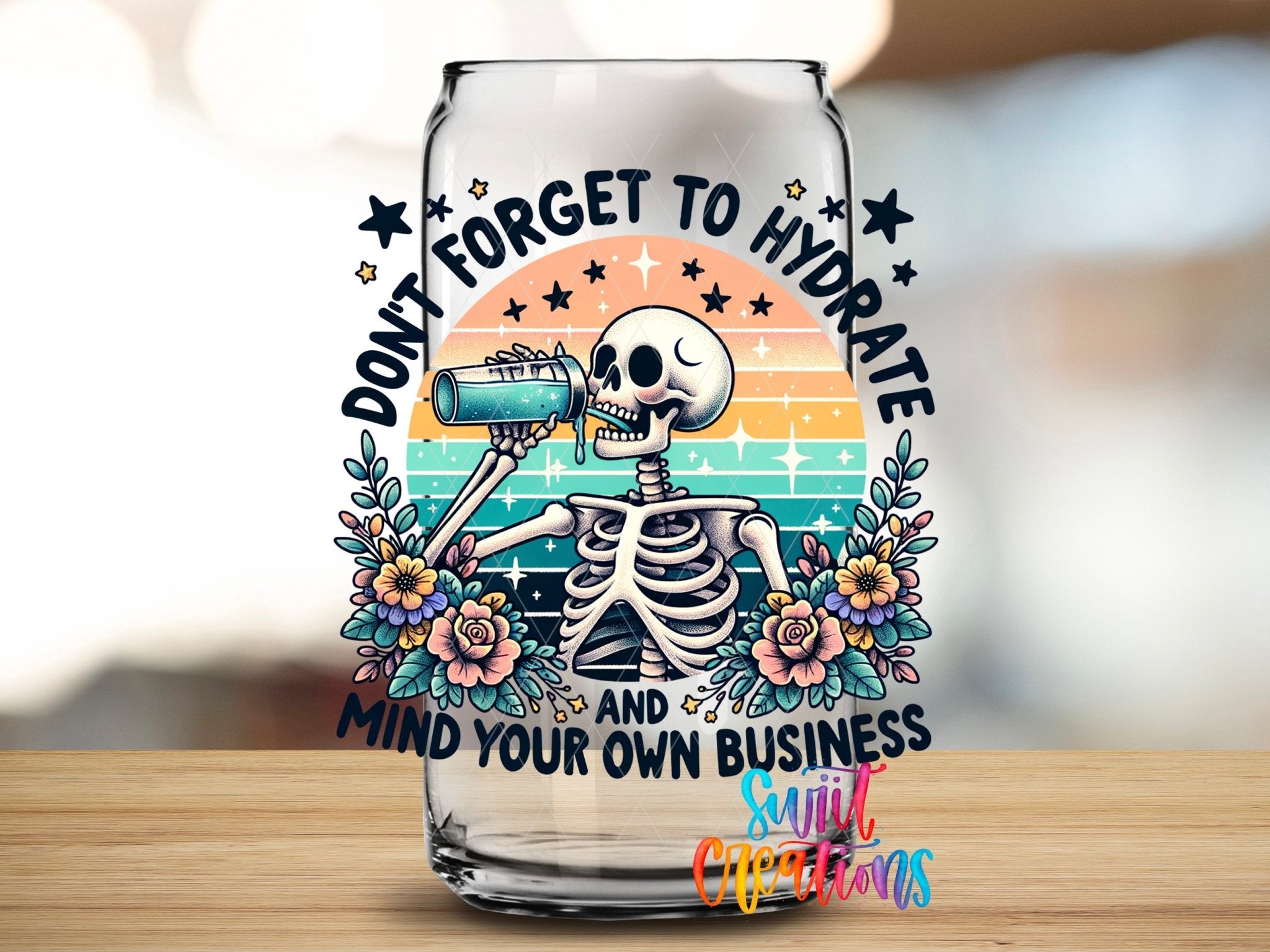 Don’t Forget to Hydrate UV DTF transfer applied to a clear glass can from Swiit Creations