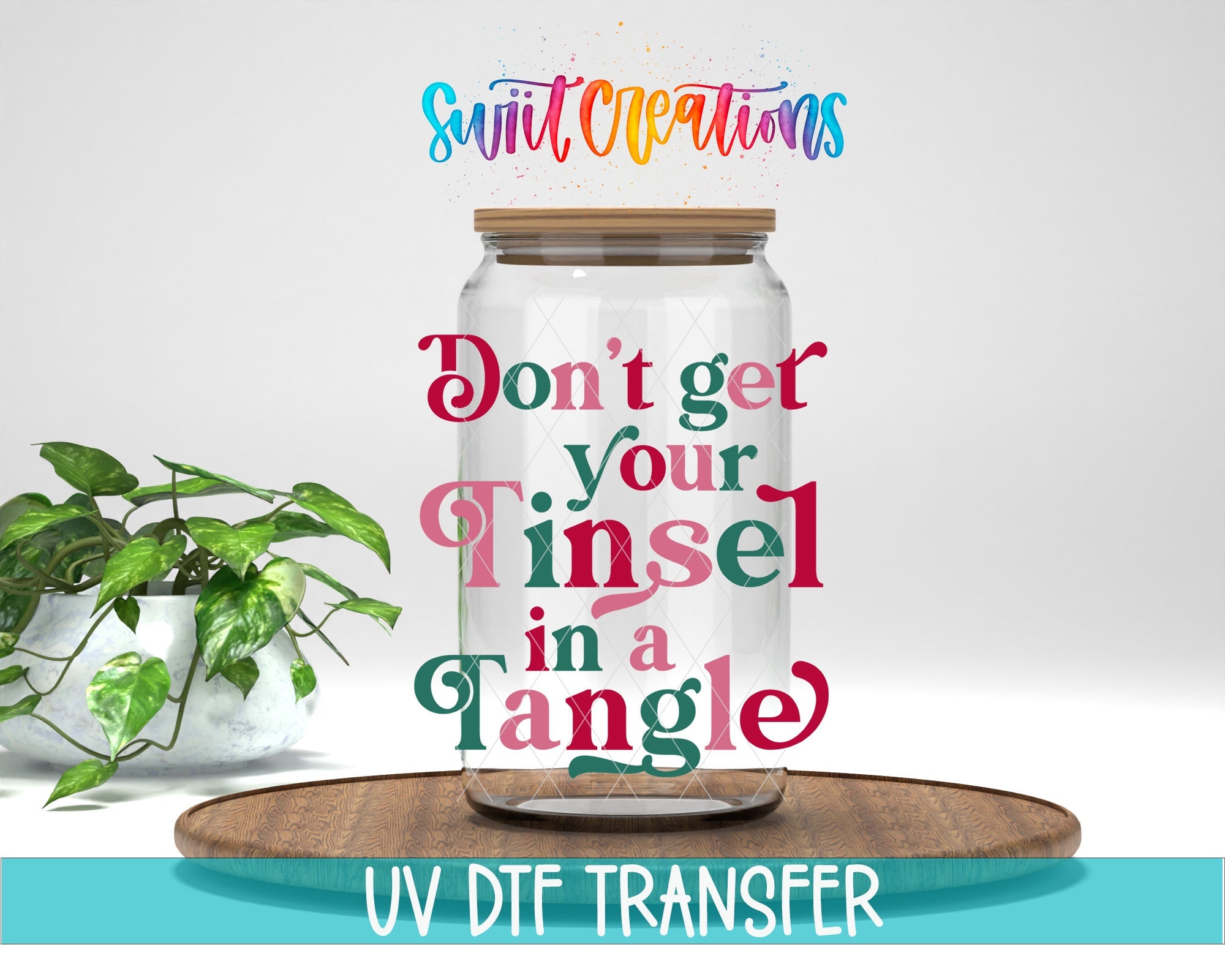 Swiit Creations UV DTF Don’t Get Your Tinsel In A Tangle transfer displayed on a clear jar mockup