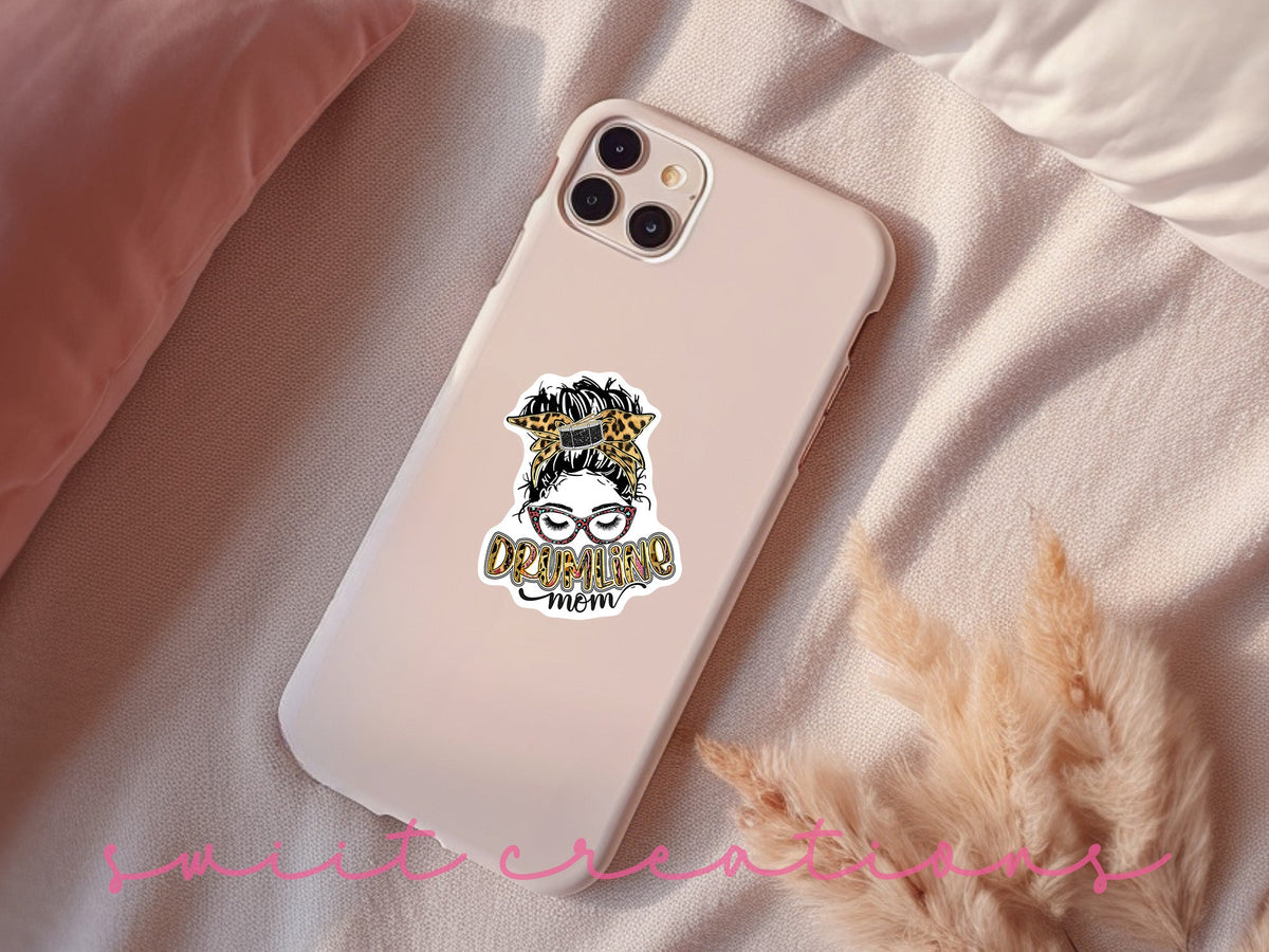 Drumline Mom sticker on a pink phone case