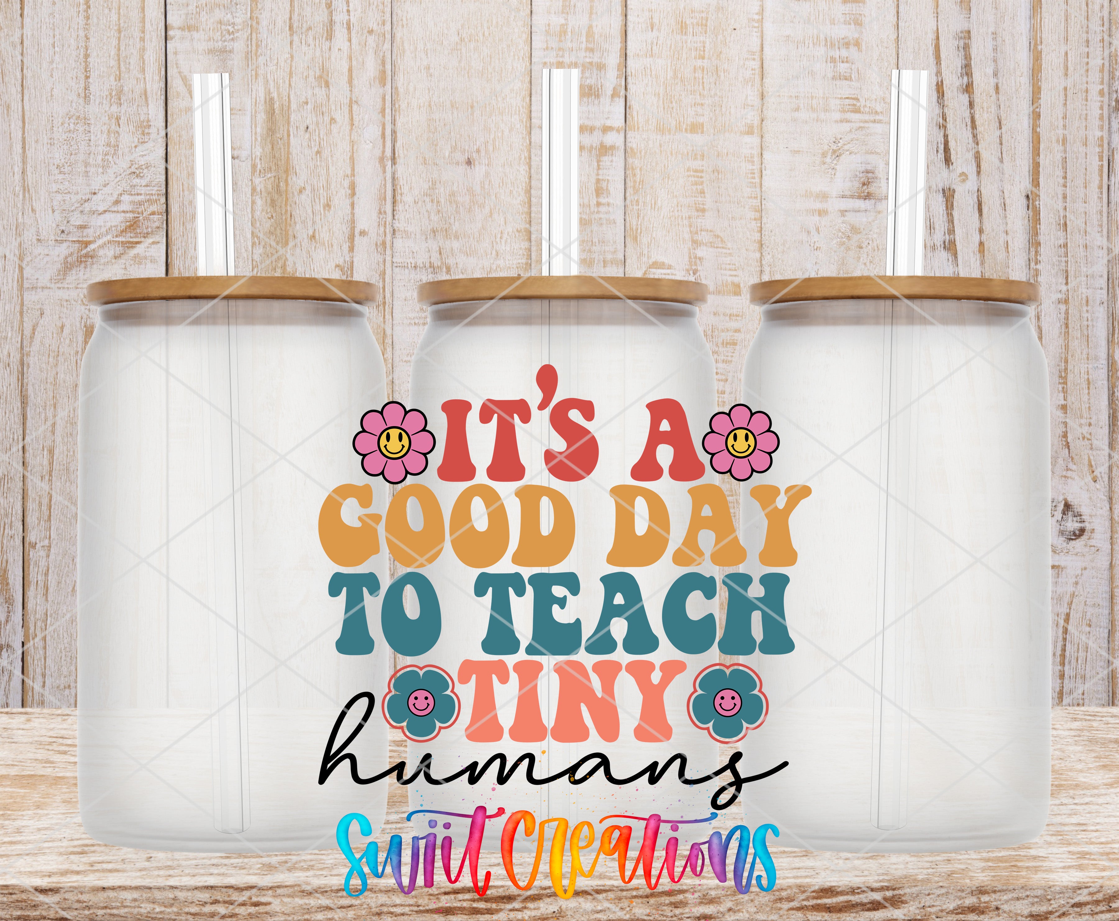 Swiit Creations UV DTF It’s A Good Day To Teach Tiny Humans transfer shown on a clear glass can set