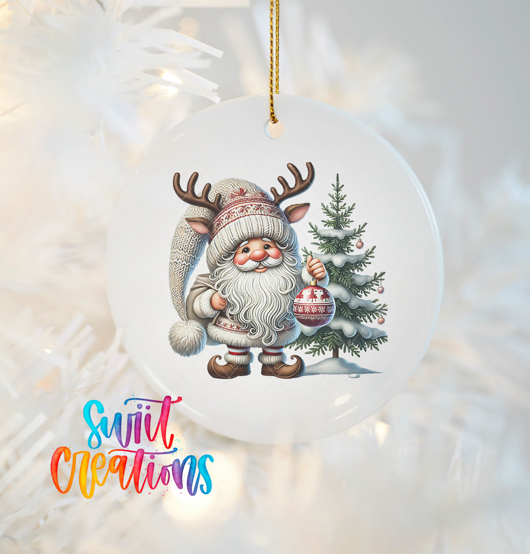 A white ornament featuring a Santa Claus figure with antlers and a Christmas tree, with the text "Swift Creations" below the ornament.