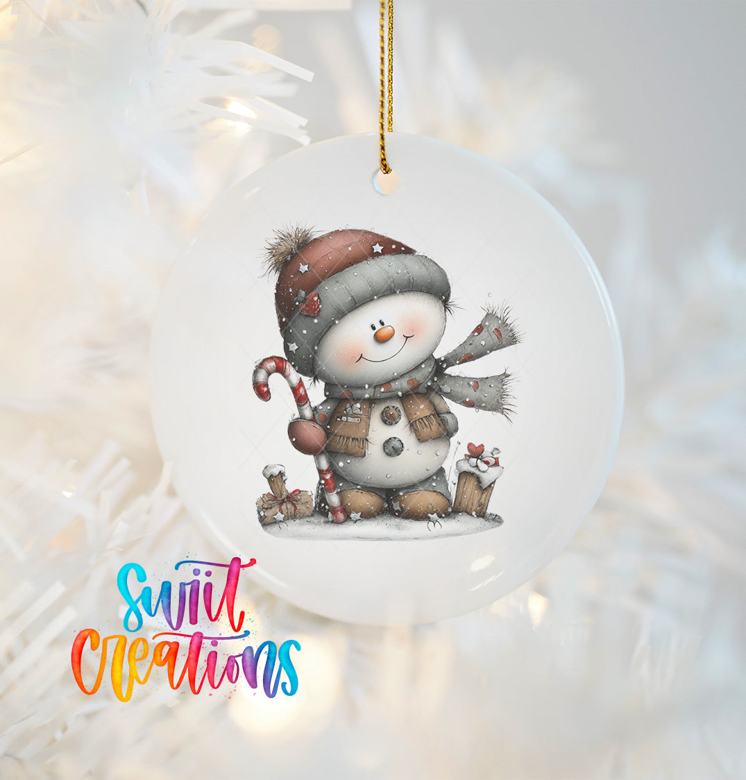 A snowman ornament with a candy cane and other winter accessories, hanging on a Christmas tree.