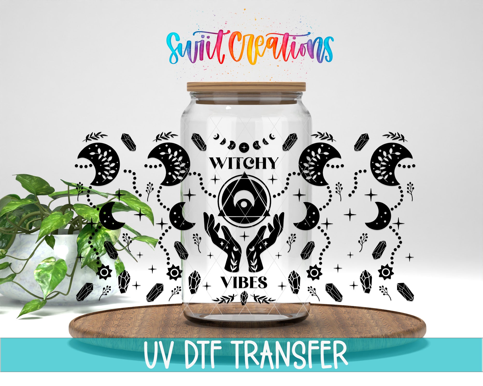 a glass jar with a label that says "Witchy Vibes" and has various mystical and supernatural symbols on it. The jar is placed on a wooden surface, and there is a plant in the background. The image also includes text that says "Swit Creations" and "UV Dtf Transfer".