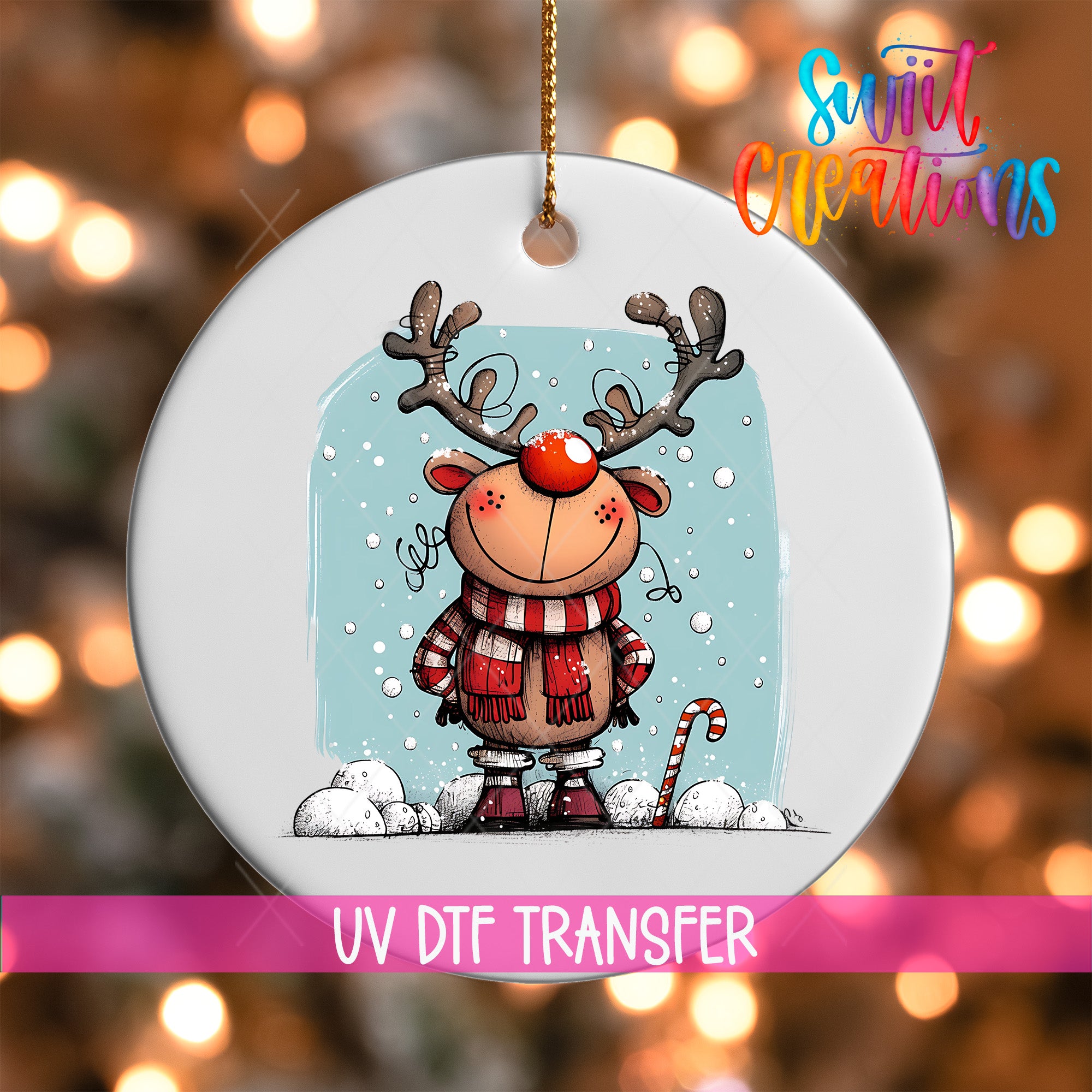 A white ornament featuring a cartoon reindeer with antlers and a red nose, surrounded by snow and a candy cane, against a background of colorful lights.
