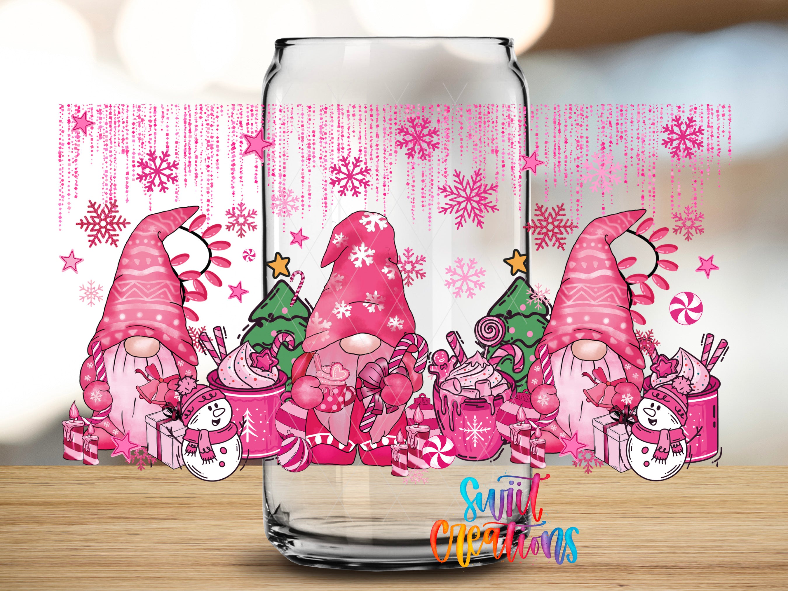 A glass jar with a festive Christmas-themed design featuring pink gnomes, snowmen, and candy canes.