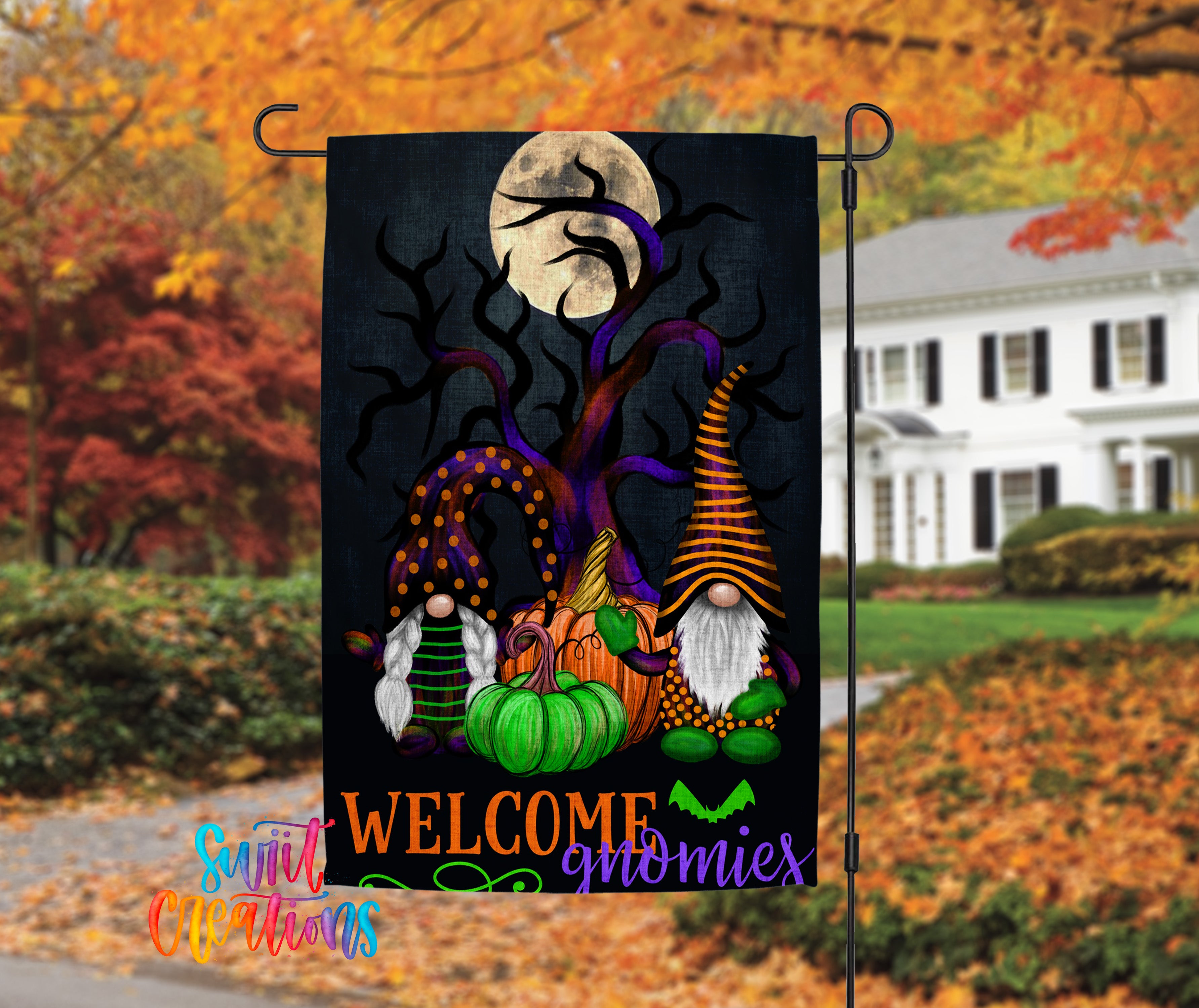 A Halloween-themed garden flag featuring gnomes, pumpkins, and a full moon against a dark background.