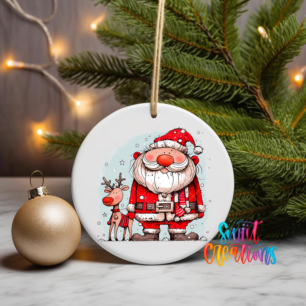 A white ceramic ornament featuring a cartoon illustration of Santa Claus and a reindeer, with a Christmas tree and twinkling lights in the background.