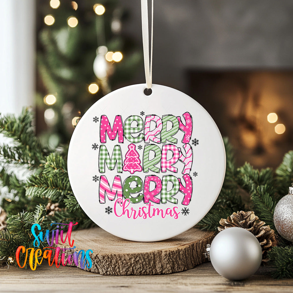 A white ceramic ornament with the text "MERRY MERRY MERRY CHRISTMAS" printed on it, surrounded by Christmas decorations such as pine cones and ornaments.